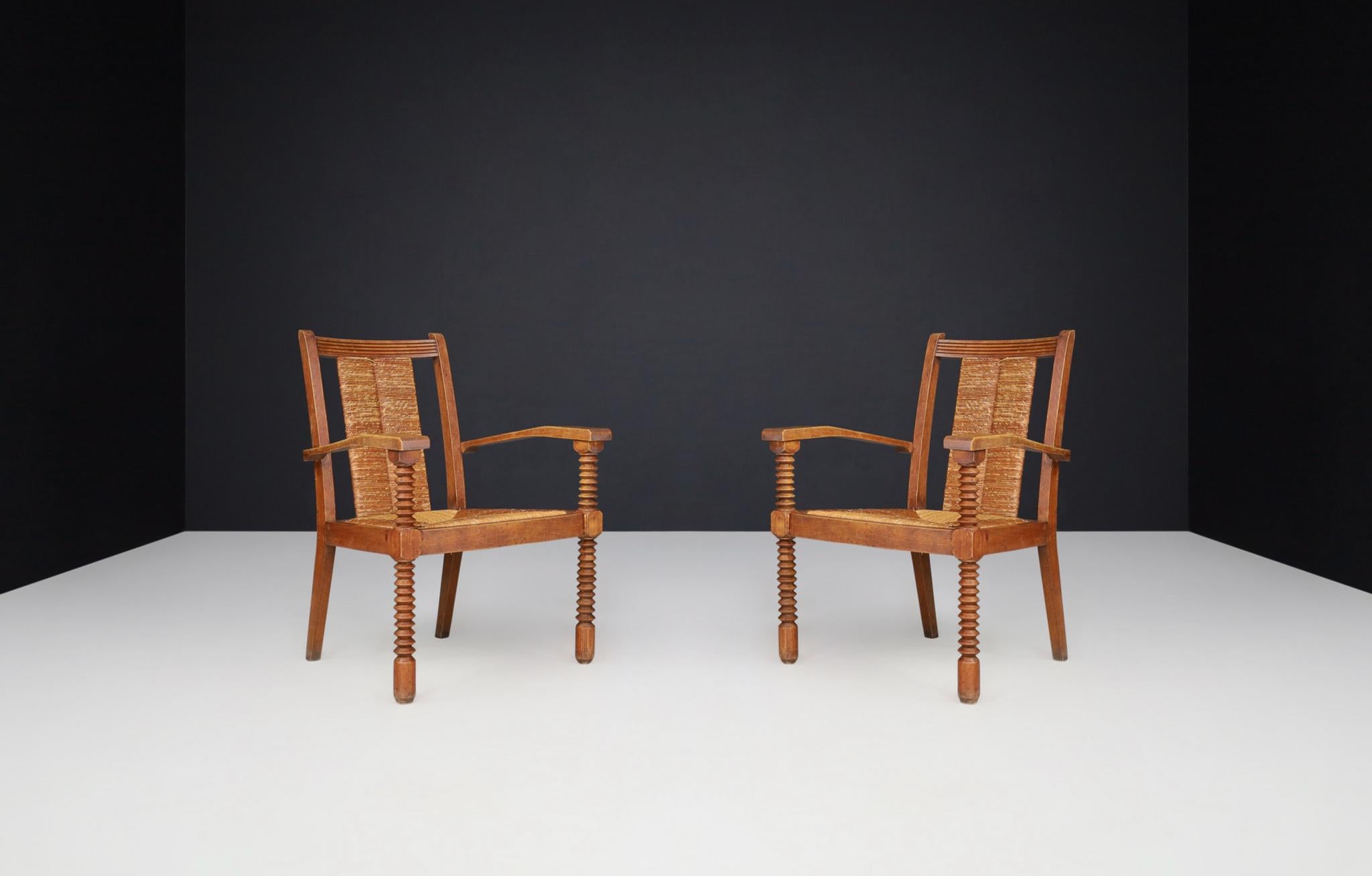 Art Deco armchairs in oak and rush, France, 1930s.

These gorgeous Art Deco armchairs were crafted in Normandy, France, circa 1930. Fantastic good original condition with a lovely patina. These chairs would be an eye-catching addition to any