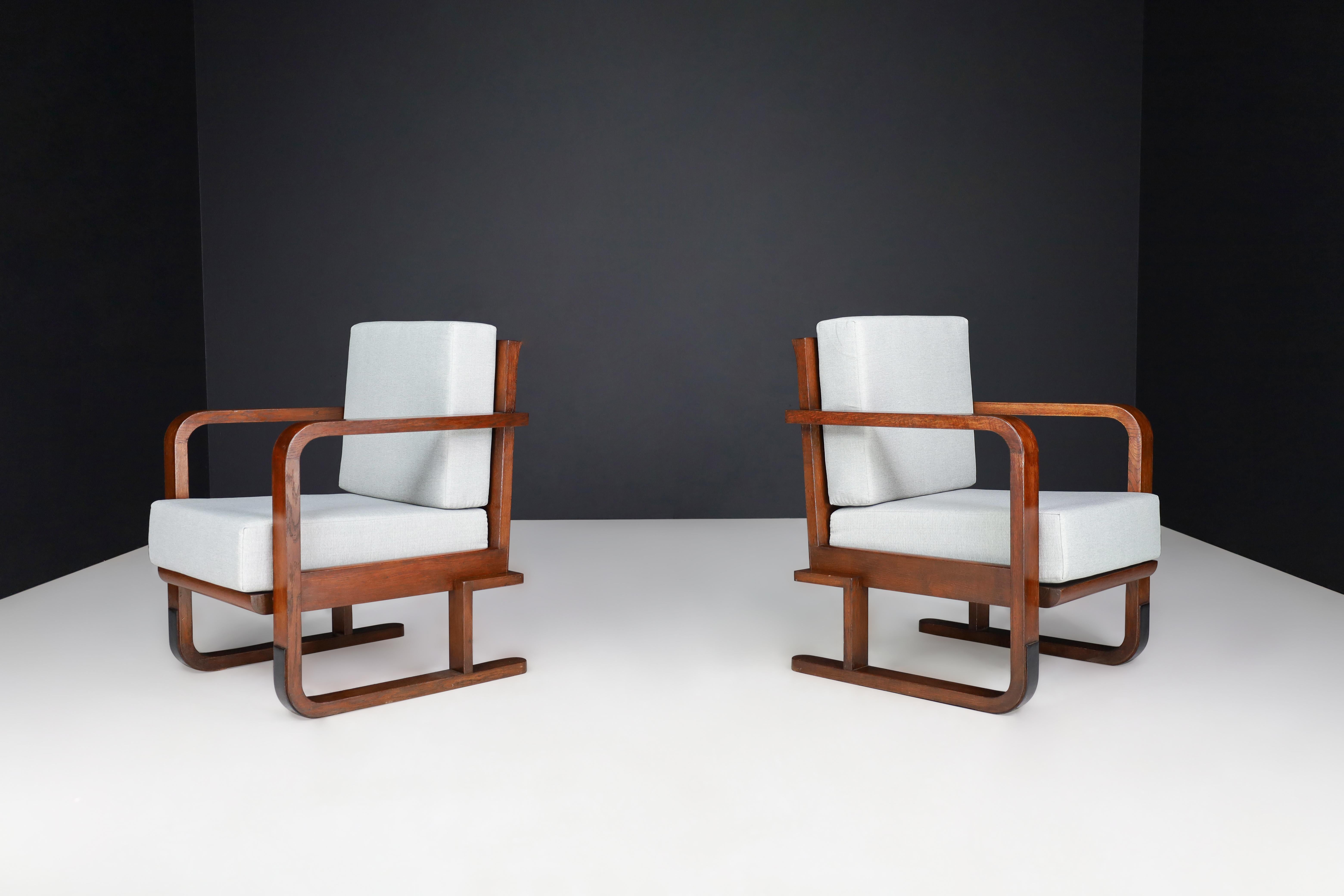 Art Deco Armchairs In Oak Bentwood and New Upholstery, Austria 1930

These are two Art Deco armchairs or lounge chairs that were made in Austria in the 1930s. They are made from Oak Bentwood and have been upholstered with new fabric. These chairs