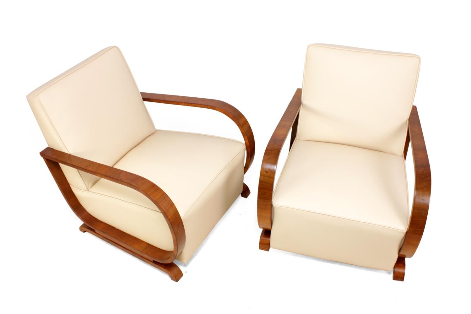 Art Deco Armchairs in Walnut and Leather, circa 1930 
A pair of Art Deco Armchairs produced in Vienna, Austria in the 1930s, these chairs have been fully reupholstered in thick hide leather and the show wood has been professionally hand polished