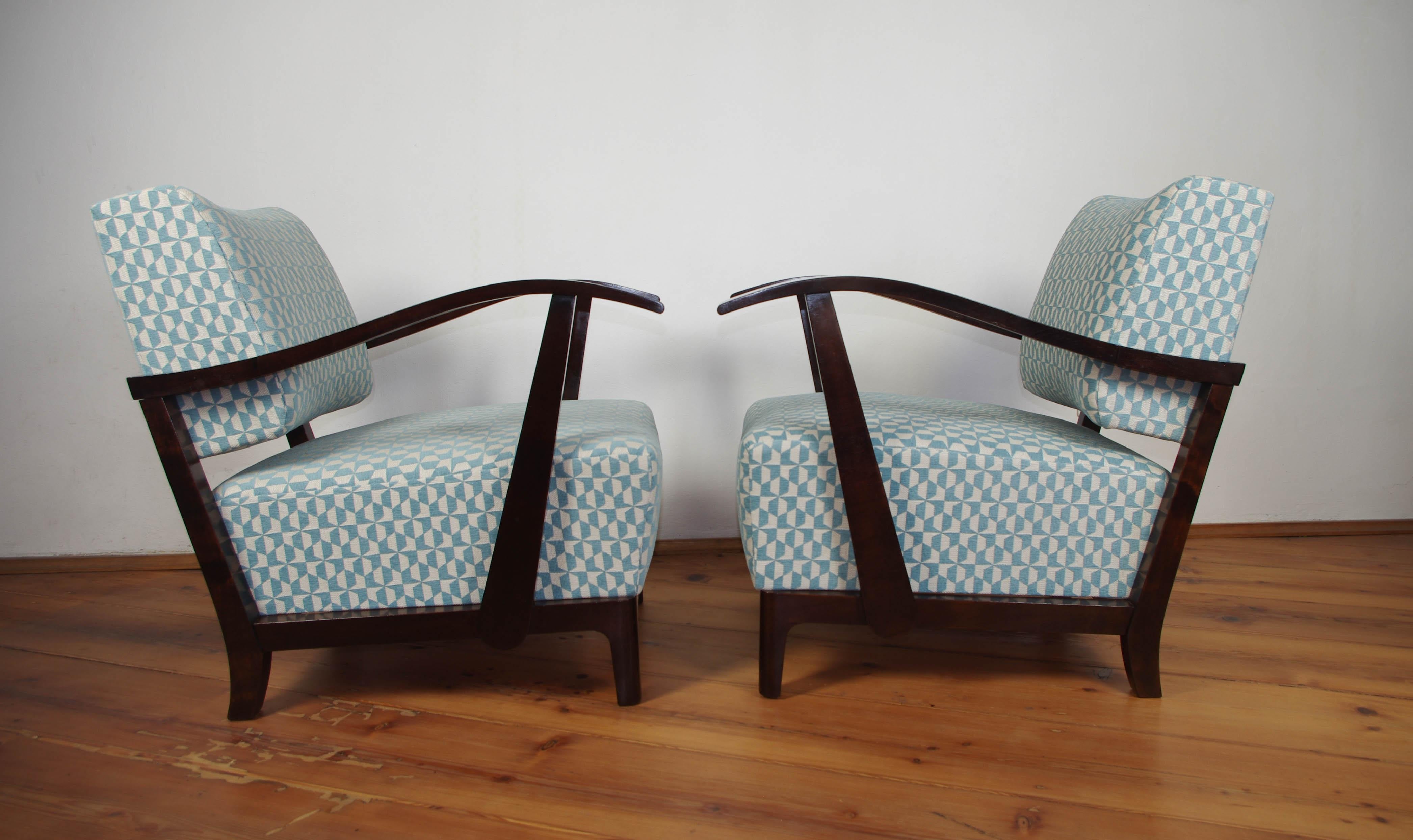 Beautifully restored set of two Art Deco armchairs. New upholstery from high quality fabric. Wooden veneered parts carefully restored and finished with new shellac. Very comfortable and eye-catching pieces.