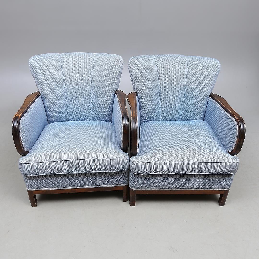 Classic pair of original Swedish Art Deco armchairs with golden birch bentwood arms in a rich darker honey color French polish finish. They have the rare fluted back which are hard to find and have a seat cushion which is unusual for the