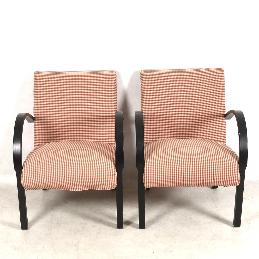 Classic pair of original Swedish Art Deco armchairs with ormolu style bentwood arms in a rich dark black French polish finish. They have the rarer open arms which are hard to find and have a very fat seat cushion for extra comfort.

They are shown