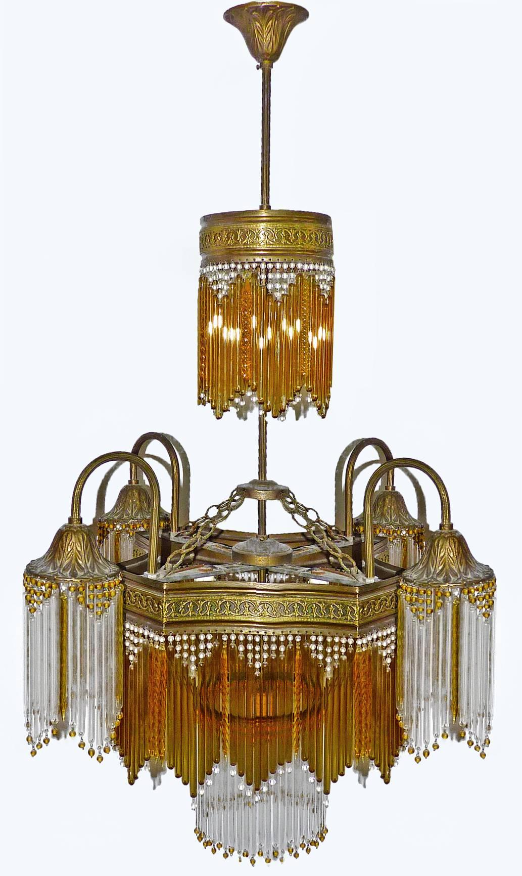 Fabulous midcentury chandelier in clear and amber glass and beads and amber crystal.
Measures: Diameter 24 in/ 60 cm
Height 36 in/ 90 cm
Weight: 5 lb/ 4 Kg
Nine light bulbs E14/ Good working condition.
Age patina.
Assembly required. Bulbs not