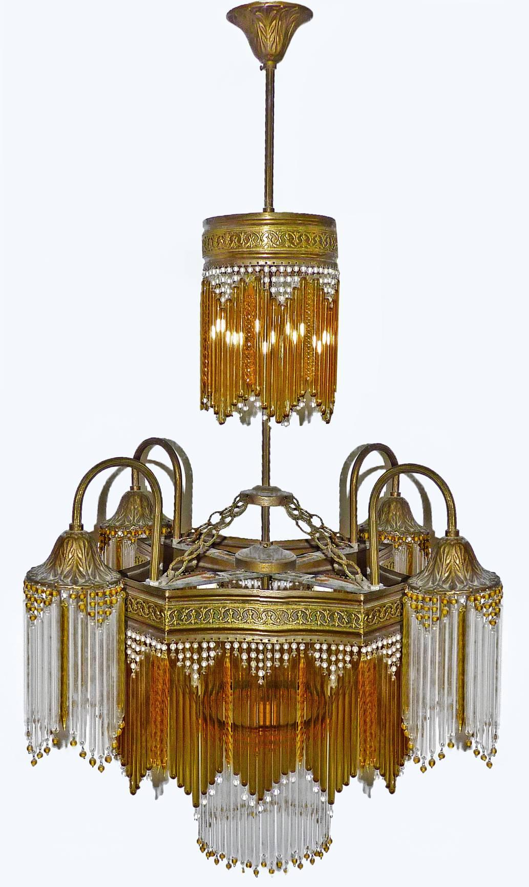 Fabulous midcentury chandelier in clear and amber glass and beads and amber crystal.
Measures:
Diameter 24 in/ 60 cm
Height 36 in/ 90 cm
Nine-light bulbs E14/ good working condition.
Age patina.
Assembly required. Bulbs not included.