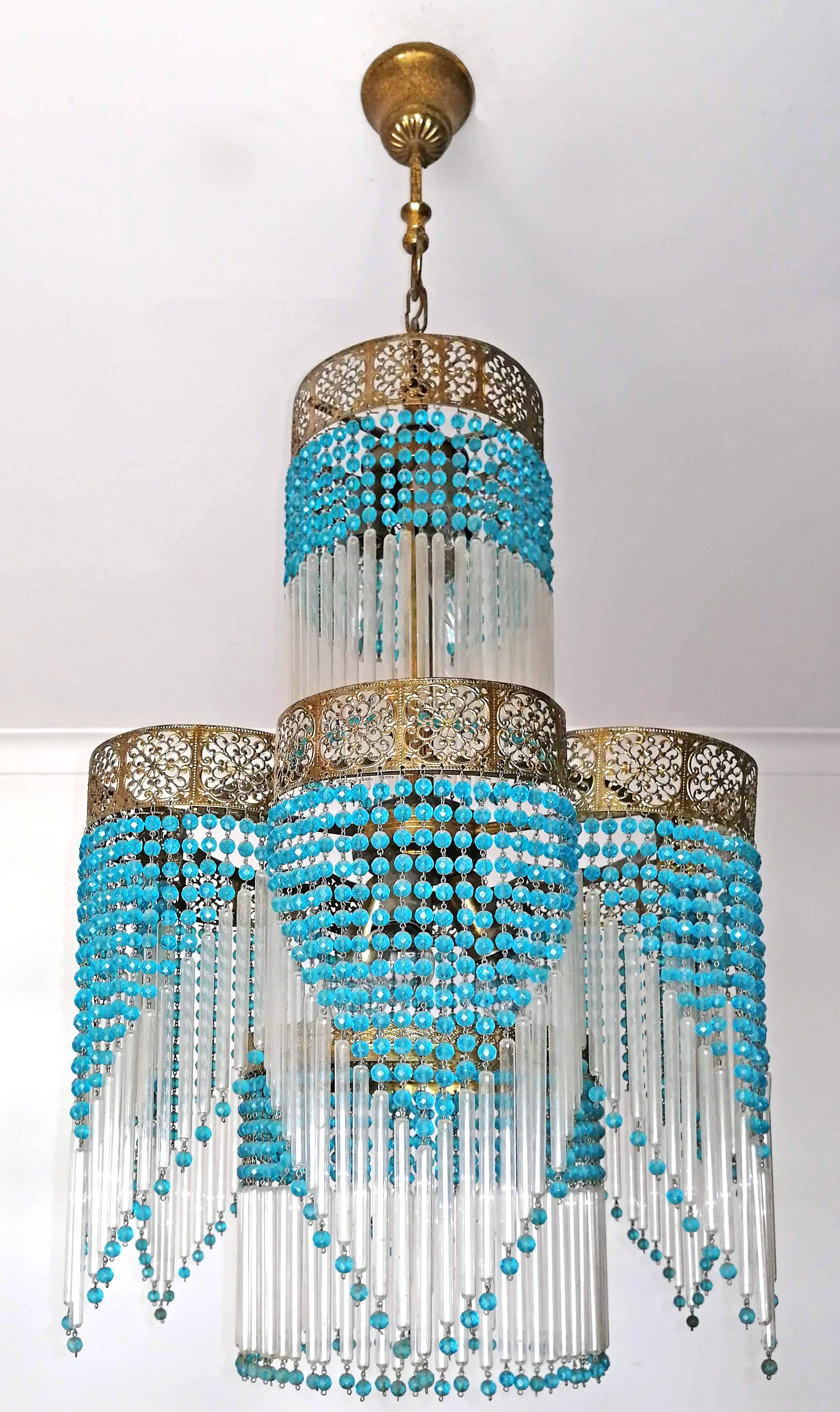 Fabulous French midcentury Art Deco/Art Nouveau chandelier in clear glass and blue beaded.
Measures: 
Diameter 15.8 in/40 cm
Height: 37.5 in /95 cm (8.6 in, 22 cm/chain).
6-light bulbs-E14/ Good working condition/European wiring.
Your item will