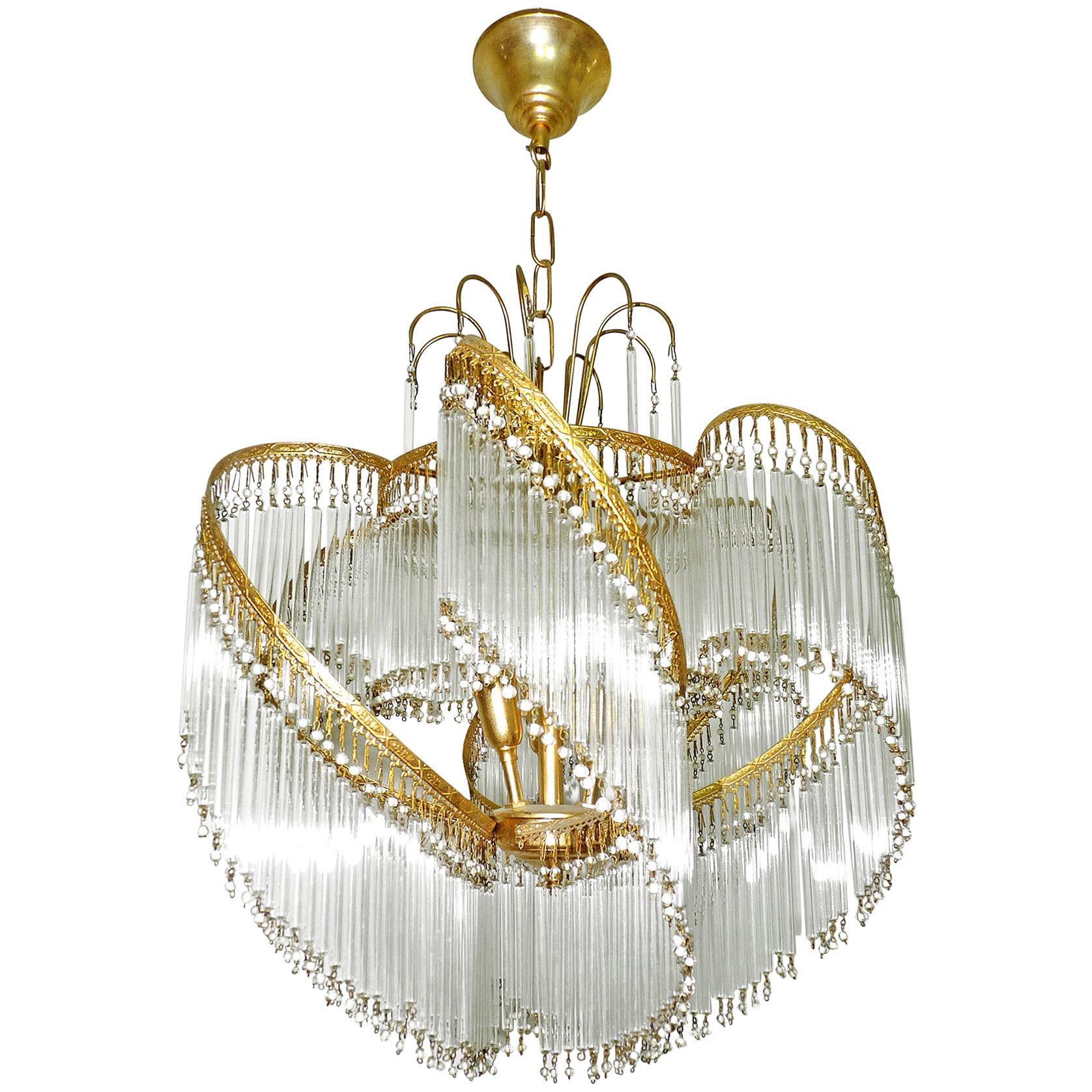 Fabulous midcentury Art Deco or Art Nouveau clear crystal glass fringe gilt spiral chandelier.
Measures:
Diameter 20 in/ 50 cm
Height 31.5 in/ 80 cm
Weight: 11 lb/ 5 Kg
Three light bulbs E14/ Good working condition/European wiring.
Your item