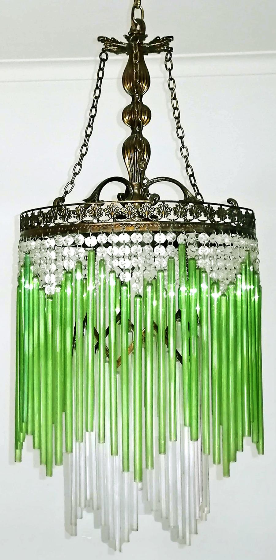 Beautiful French in clear, green fringe glass and crystal beaded Art Deco / Art Nouveau chandelier.
Measures:
Diameter 13 in/ 33 cm
Height 39,37 in(chain=10 in)/ 100 cm (chain=25cm)
4 light bulb each E14/ good working condition/European wiring.
Age