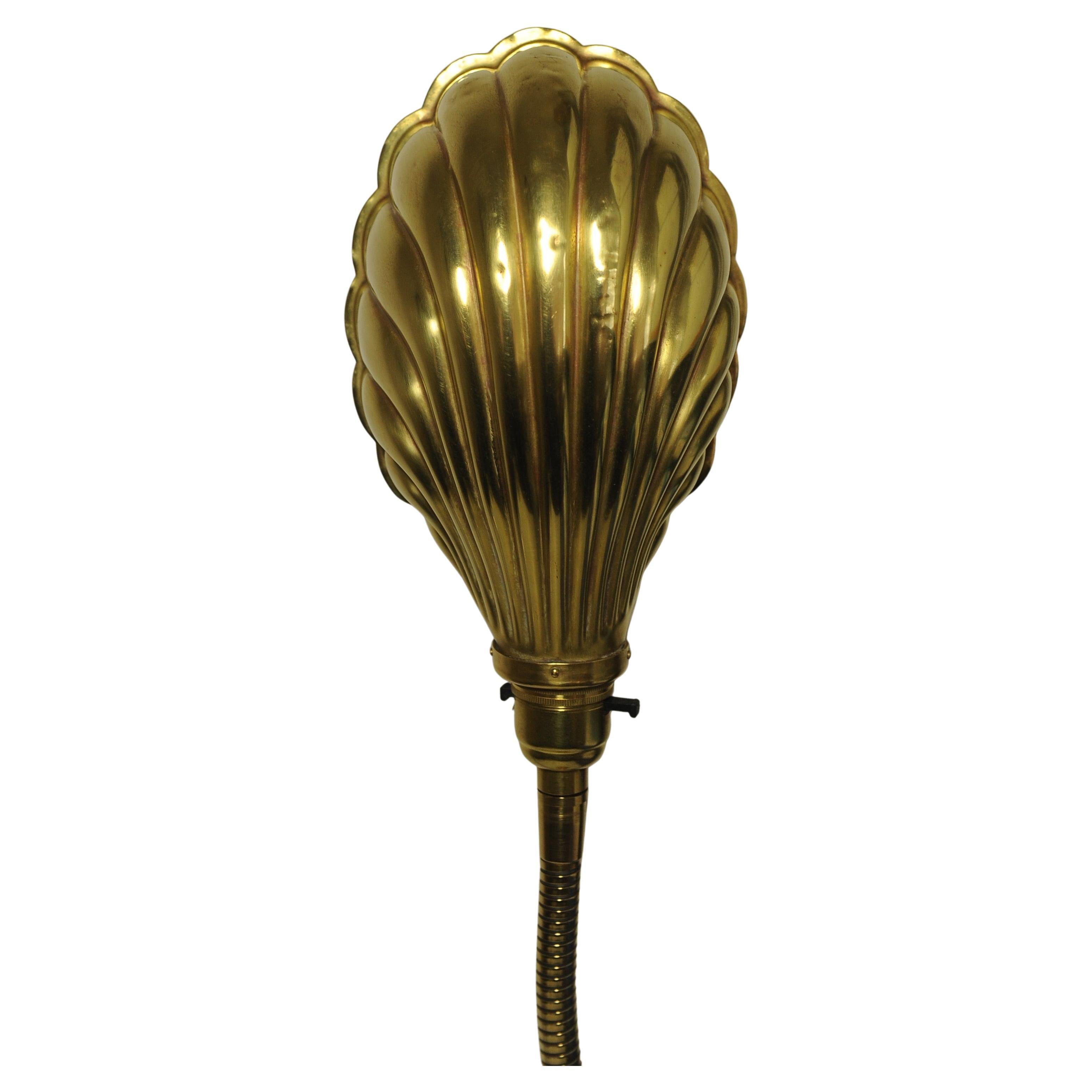 Early 20th century Art Deco articulated brass gooseneck desk lamp with decorated Brassed Copper Shell Shaped Shade on a circular brass weighted base 1920s.