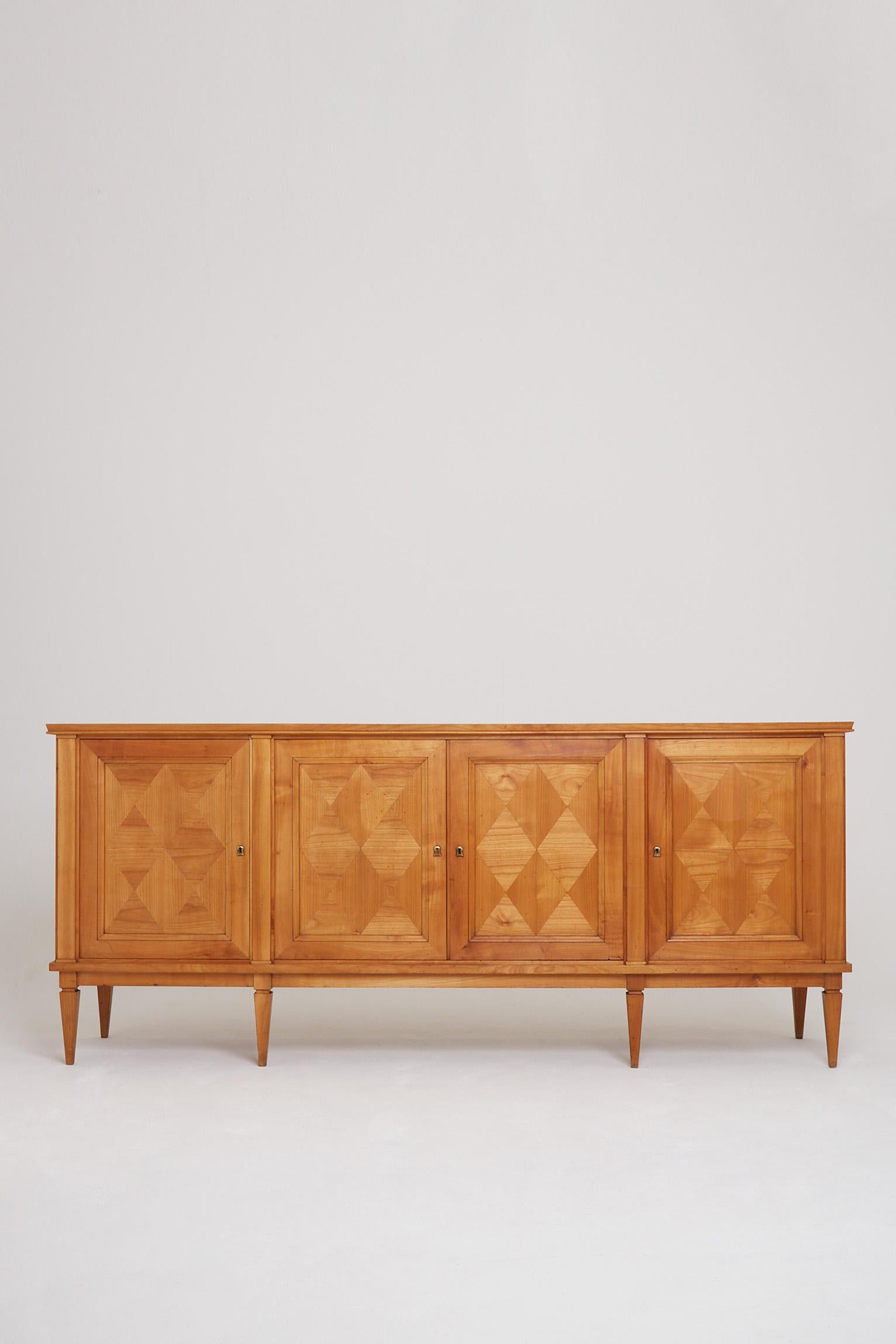An Art Deco ash four door sideboard, with diamond shaped parquetry.
France, circa 1940.