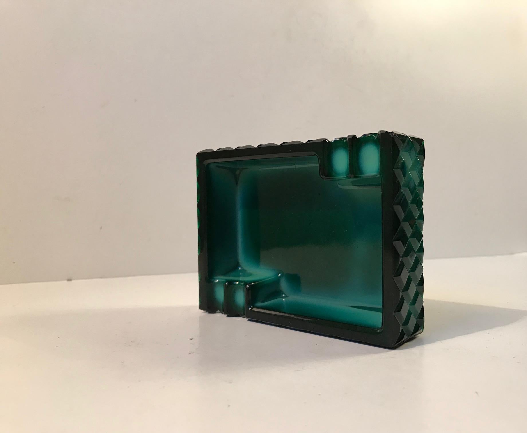 Stylish Art Deco ashtray in malakit glass. Diamond pattern exterior. Manufactured in Bohemia during the 1930s by an anonymous glass maker.