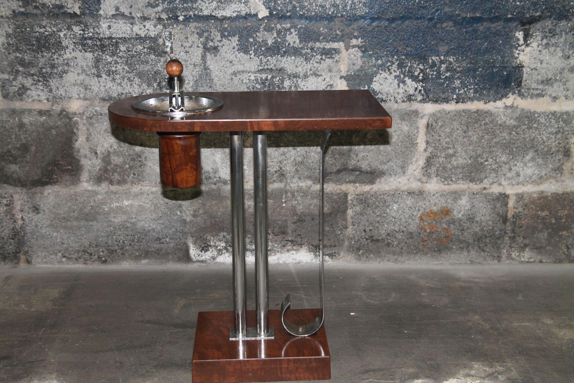 Wonderful Art Deco smoking stand made of bakelite veneer and chrome. This great stand was designed by Charles Hardy for Belmet Products Inc, in Brooklyn NY. The patent for this design was awarded to Hardy in 1936. This is as good as it gets. Veneer