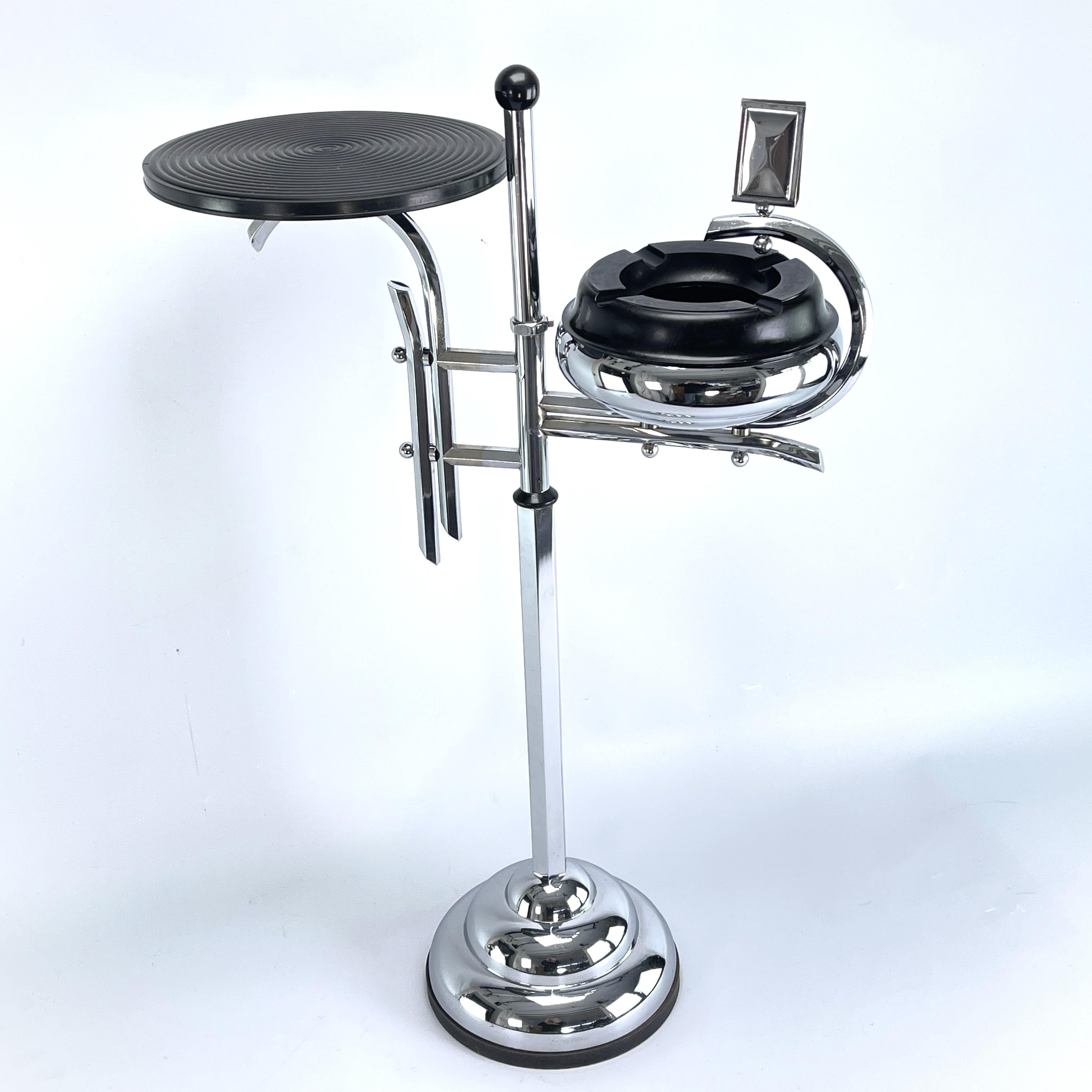 Art Deco ashtray stand

This beautiful and rare Art Deco Ashtray Stand from the 30s/40s is in the streamline modern art deco style. The designer of this extraordinary object has succeeded in combining functionality, design, style and aesthetics.