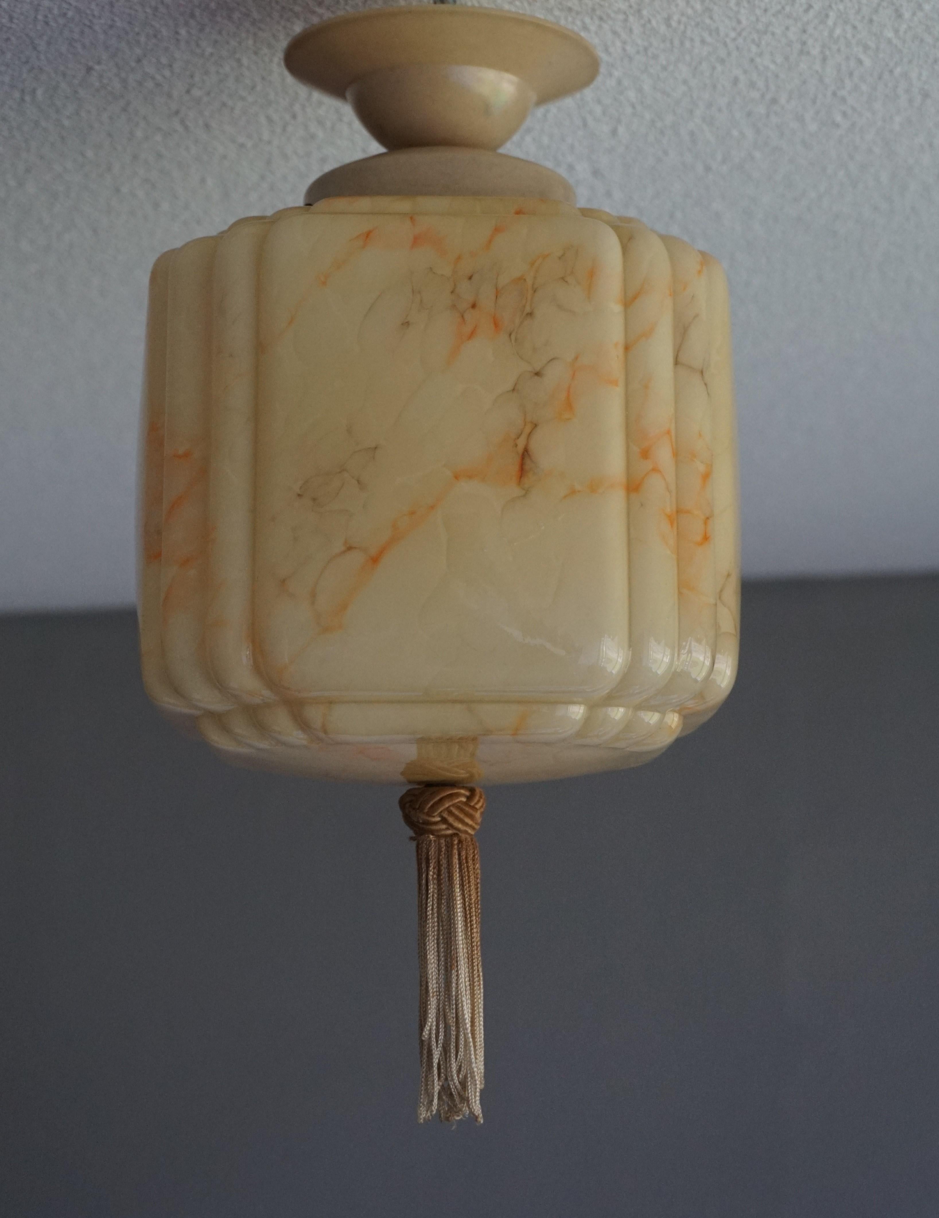 Handcrafted and rare, Asian lantern-like pendant.

This rare combination-of-styles pendant / flush mount is in excellent condition and a joy to own and look at. It actually comes from the same home as the Asian American style pendant we sold via