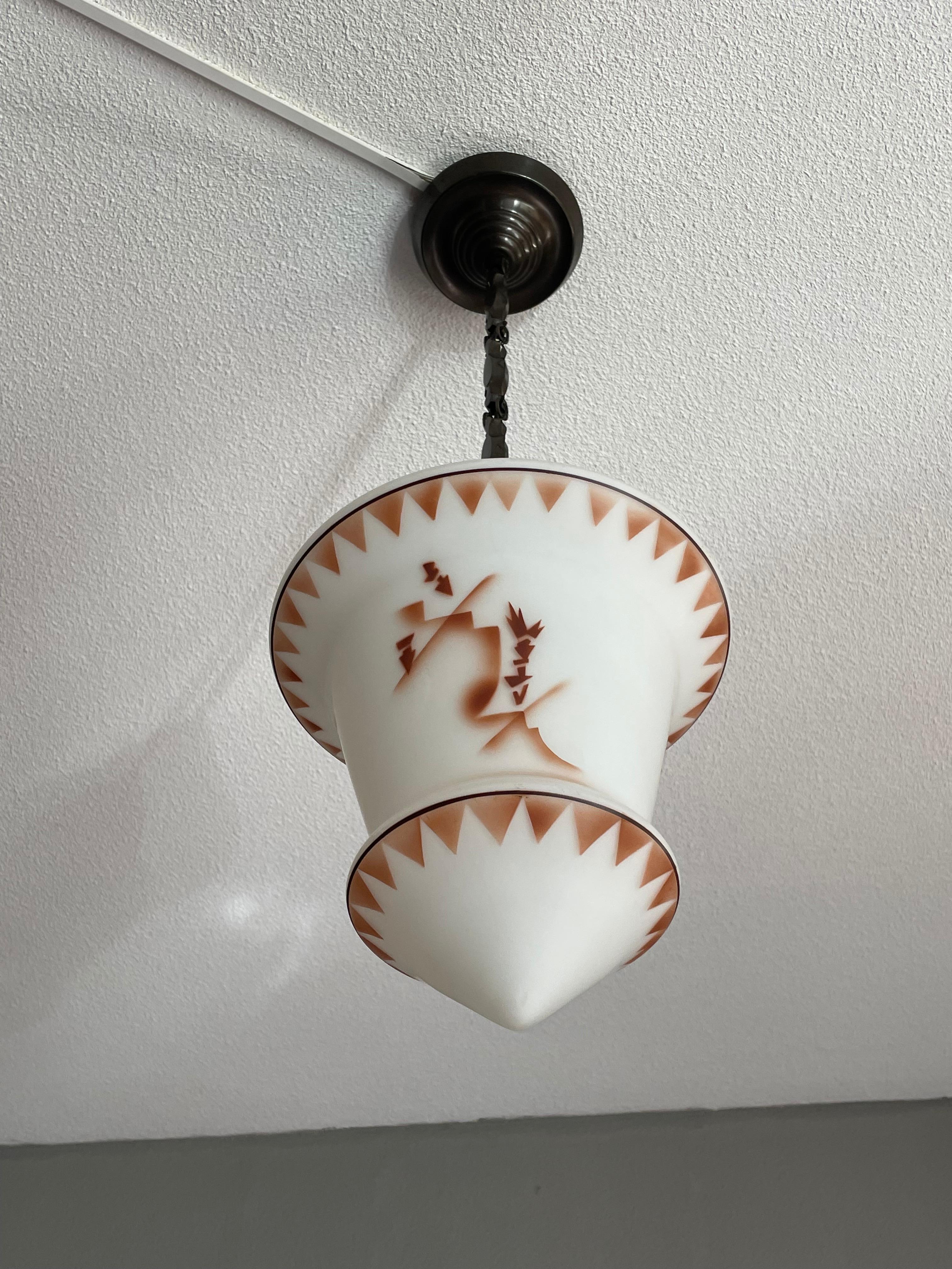 Handcrafted and rare, Asian style, opaline glass lantern pendant.

This rare combination-of-styles pendant is in superb condition and a joy to own and look at. We had never before seen a 1920s pendant of this rare Asian design and to have found it