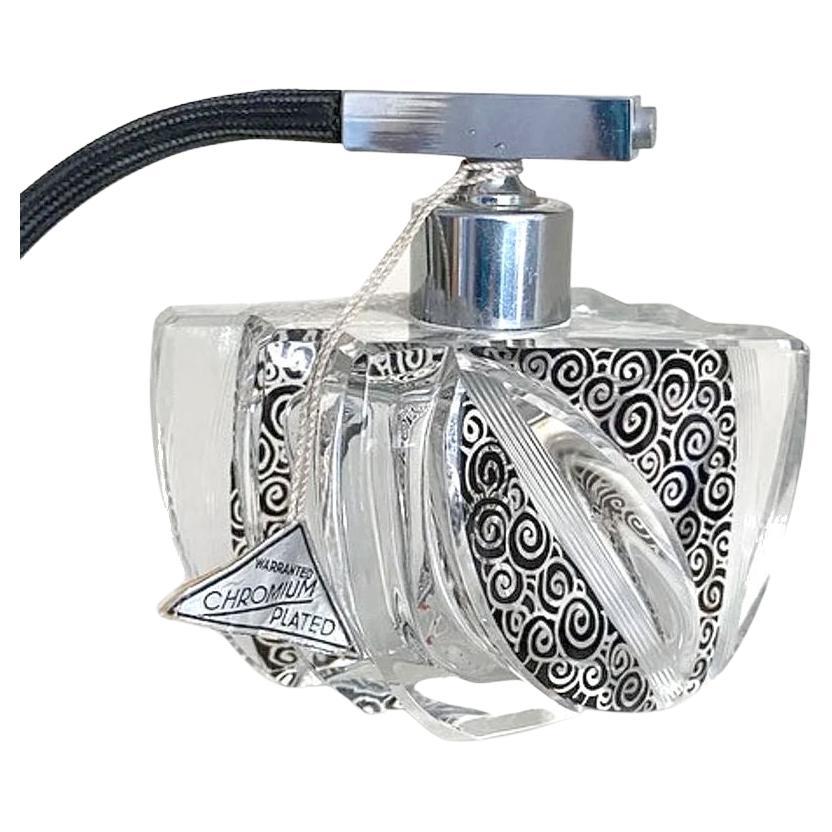 Still with it's original label and looking to have never been used is this superbly stylish Art Deco cut glass perfume atomizer dating to the 1930's. Offered with no damage and little to no wear this is a perfect find that will be an asset to any