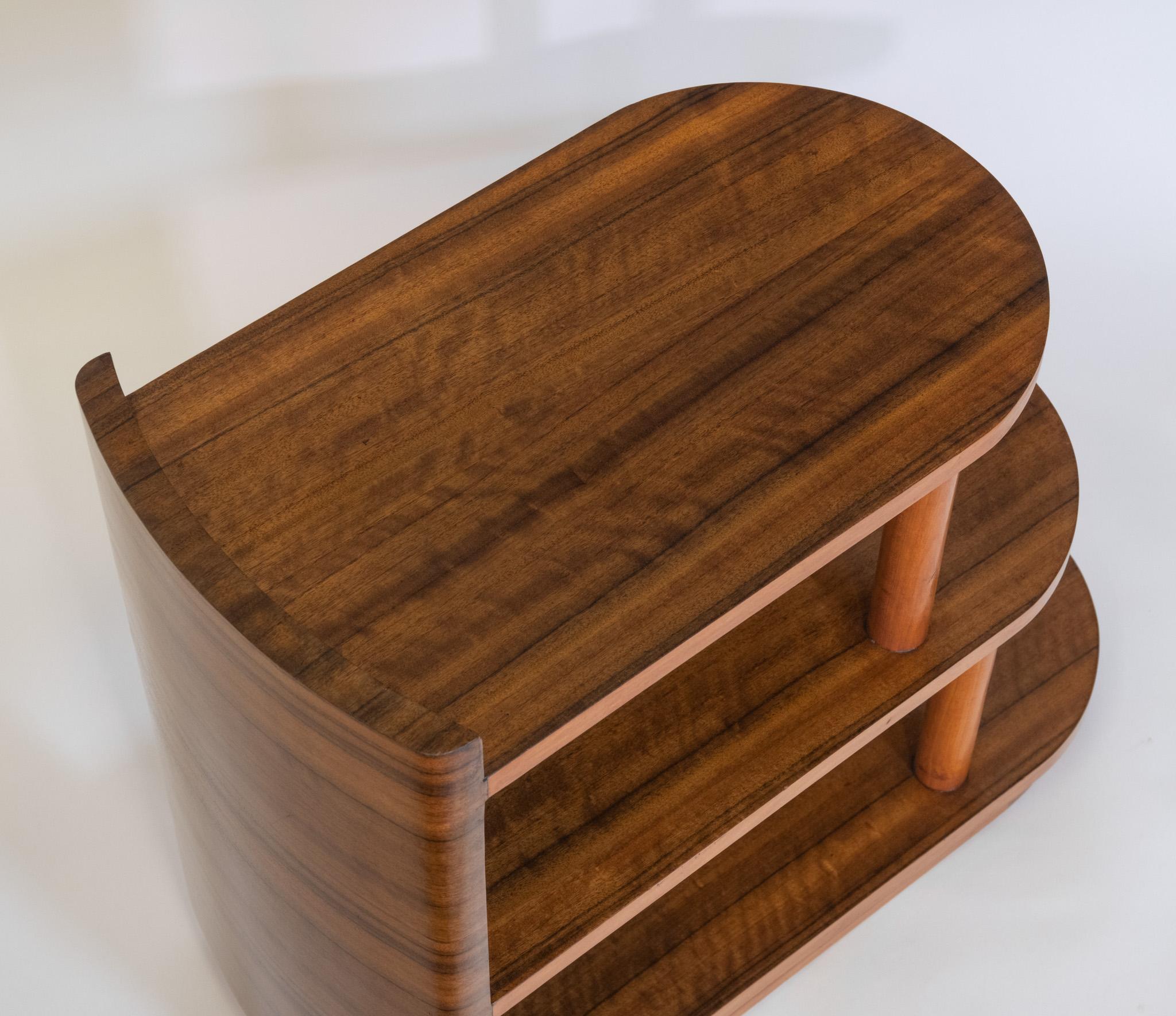 Stylish Art Deco Australian walnut three tiered side table. Circa 1930s.

The table having three step-form tiers with curved ends on a shaped end upright. Of excellent quality, the tiered tables and base are made in solid walnut, having the