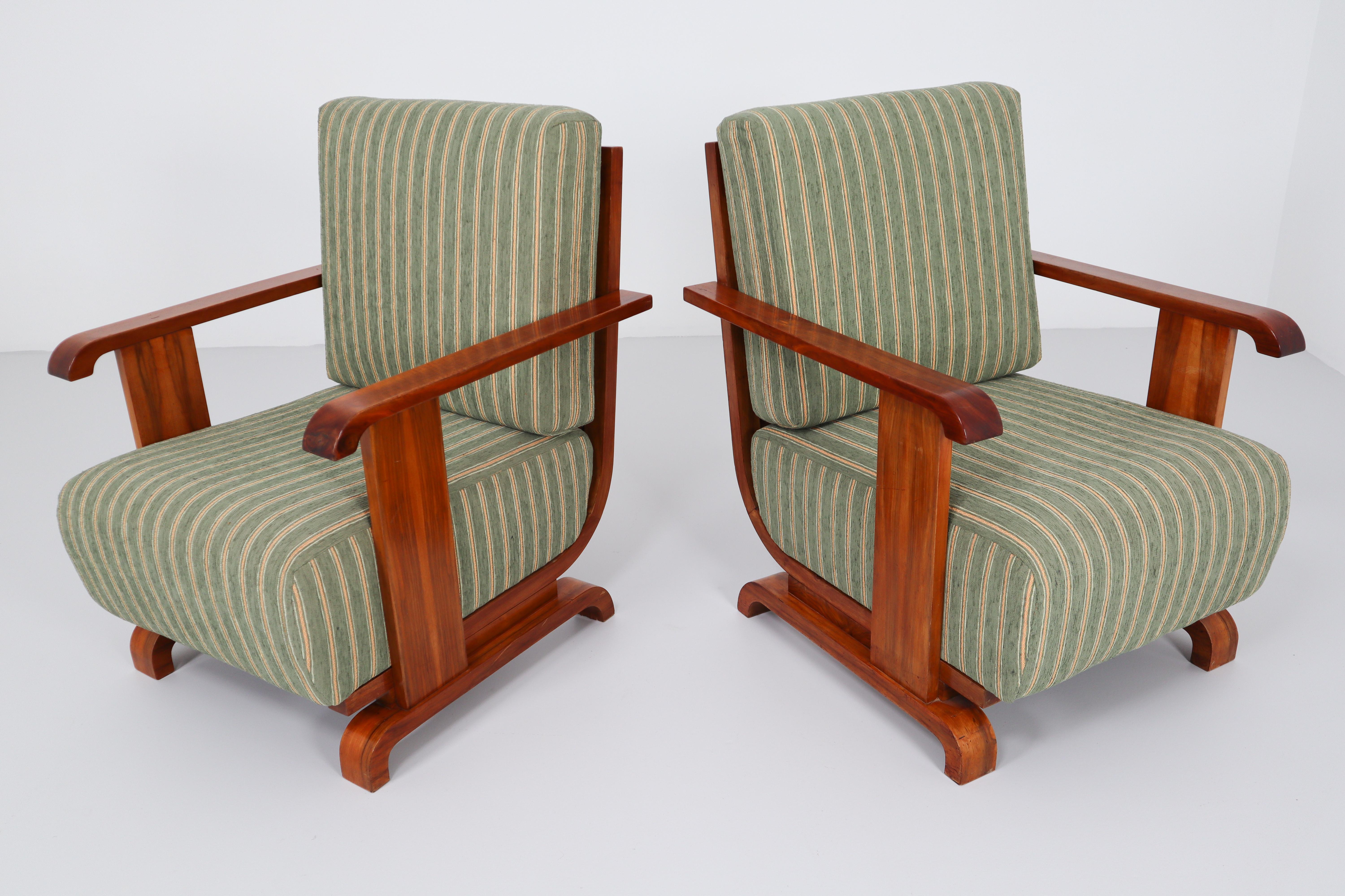 A pair of Art Deco Austrian armchairs from Vienna, reupholstered in a new olive green velvet blend. The frame and arms are made of a beautiful walnut. We couldn’t resist the comfort and impeccable lines of these.
