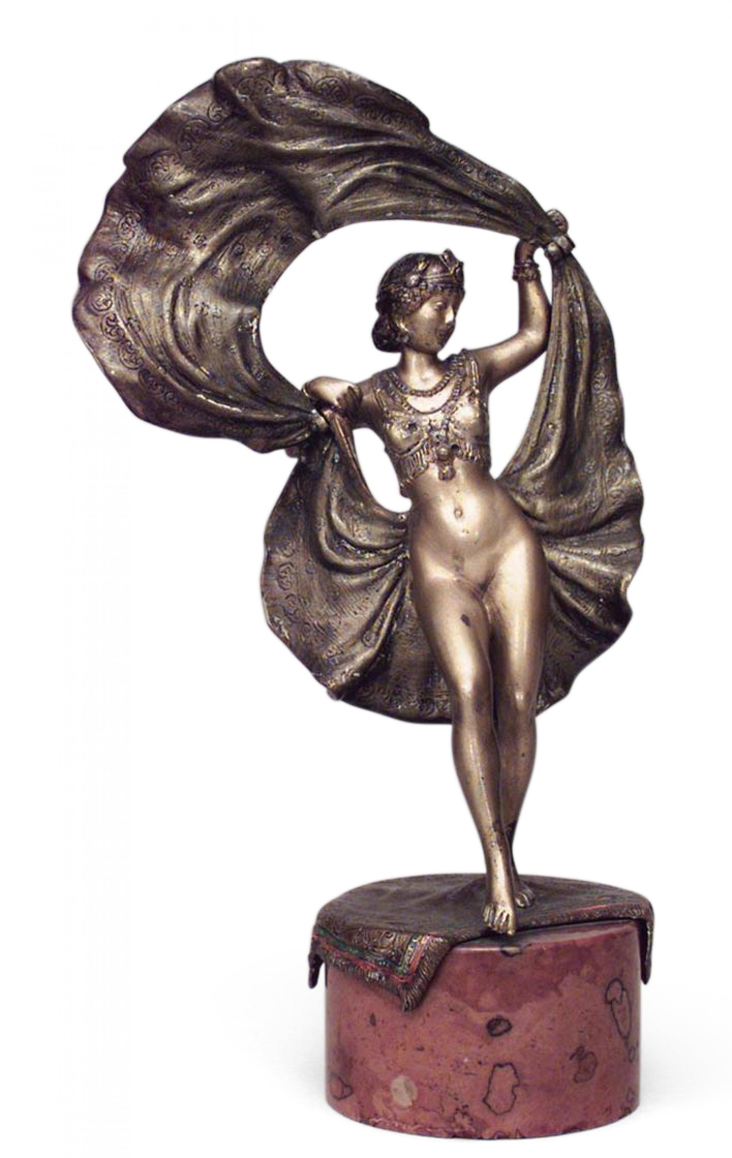Art Deco Austrian bronze figure of erotic female dancer with movable flipped up skirt on round marble base (signed BERGMAN).
 