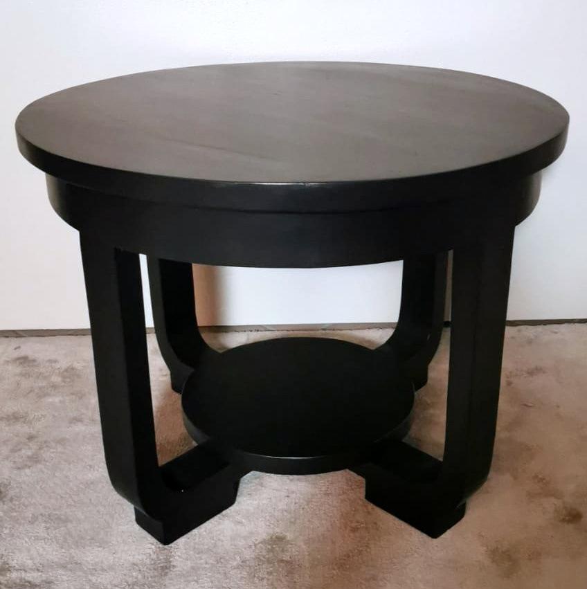 We kindly suggest that you read the entire description, as with it we try to give you detailed technical and historical information to ensure the authenticity of our objects. 
Refined and elegant Austrian Art Deco coffee table made of walnut painted