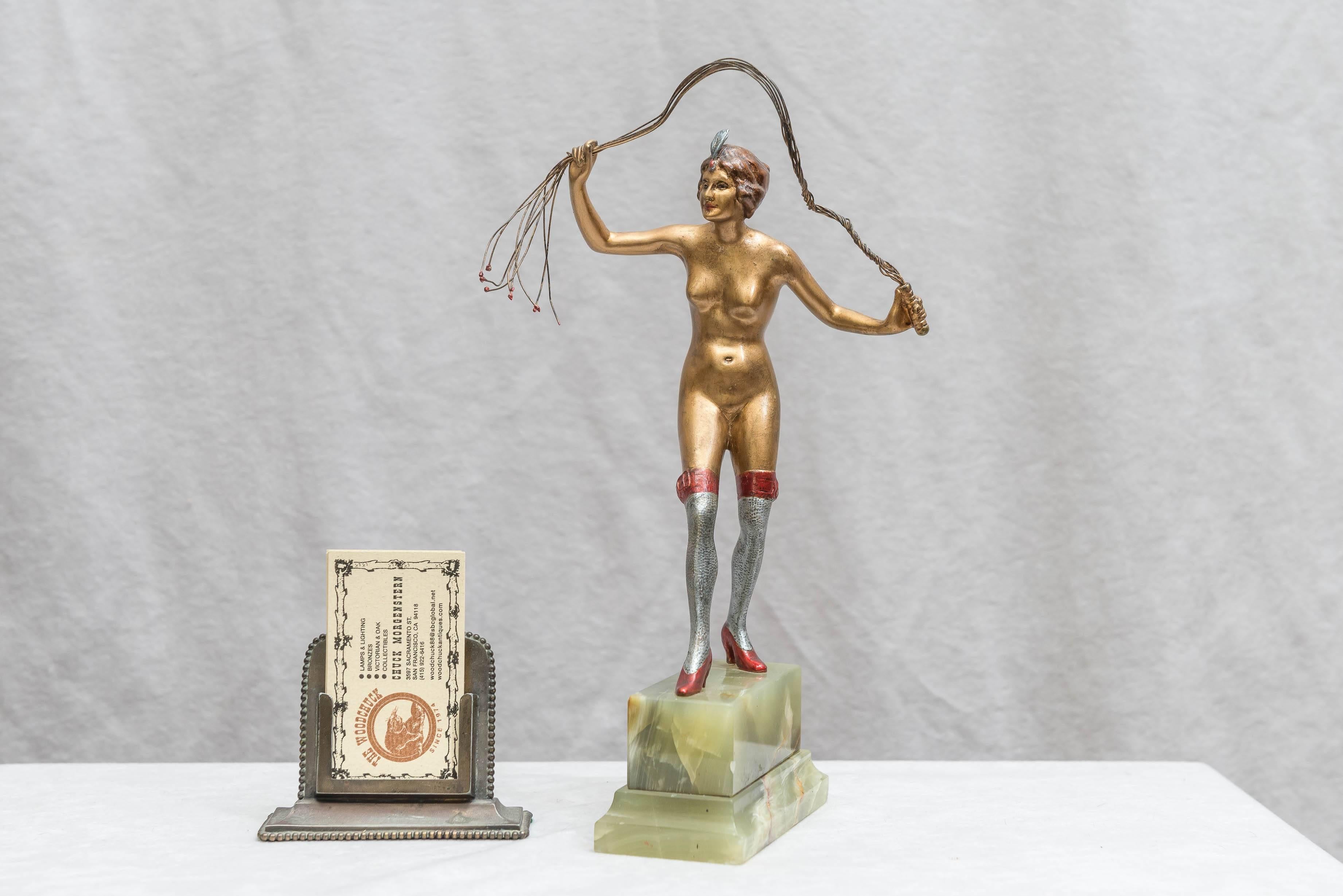 Here is a bronze you don't frequently see. Yes a woman with a whip, but a cat o' nine tails? We counted the whip, it's nine tails. Definitely cold painted, Art Deco period, and Austrian. Probably done by Lorenzl. A fun piece of art.