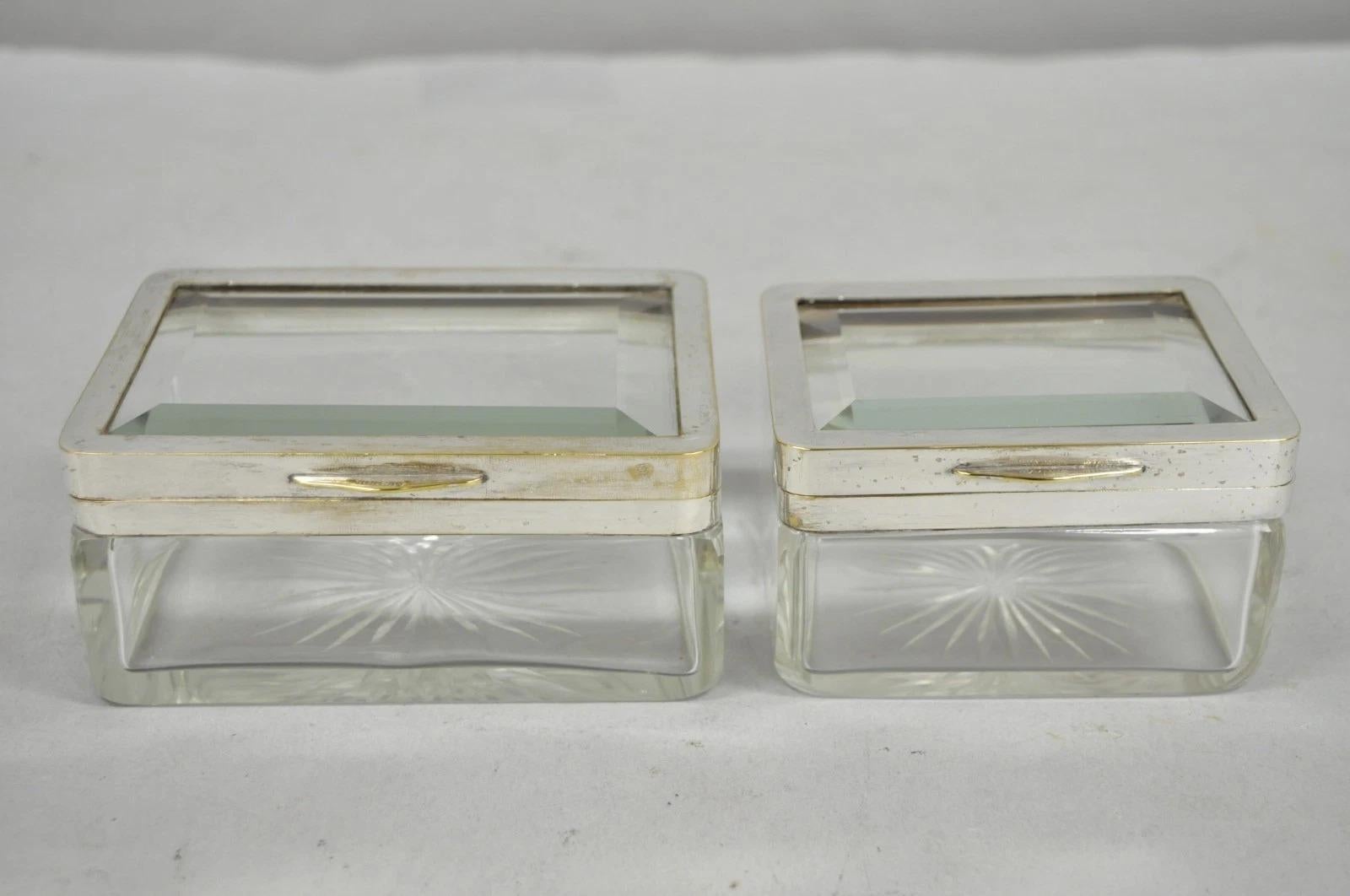 Austrian Art Deco Silver Plated Cut Glass Casket Trinket Box Set w/ Tray - 3 Pcs. Listing includes (1) Large casket (1) small casket, both with beveled glass lid, diamond cut crystal base, and silver plated mounts. Listing also includes narrow glass