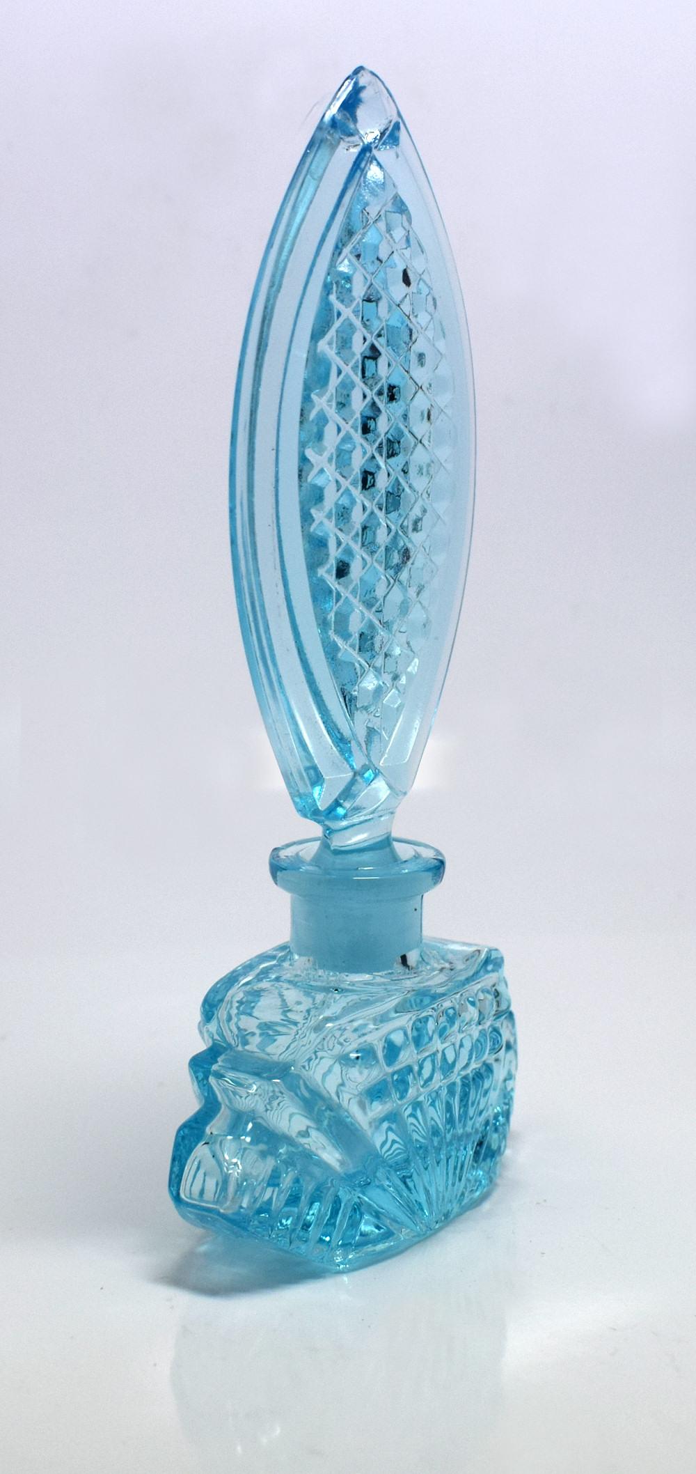 For your consideration is this stylish Art Deco style baby blue glass perfume bottle. Lovely item with no damage, just minor signs of use.