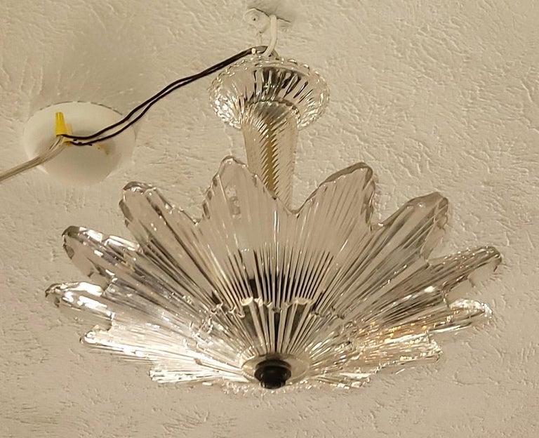 Presenting a stunning Art Deco Baccarat Semi Flush Star Burst crystal pendant.

This is a period Art Deco piece and was ‘rescued’ from a home in Dallas that was built in 1929.

Though not signed it is undoubtedly by the famous French maker …
