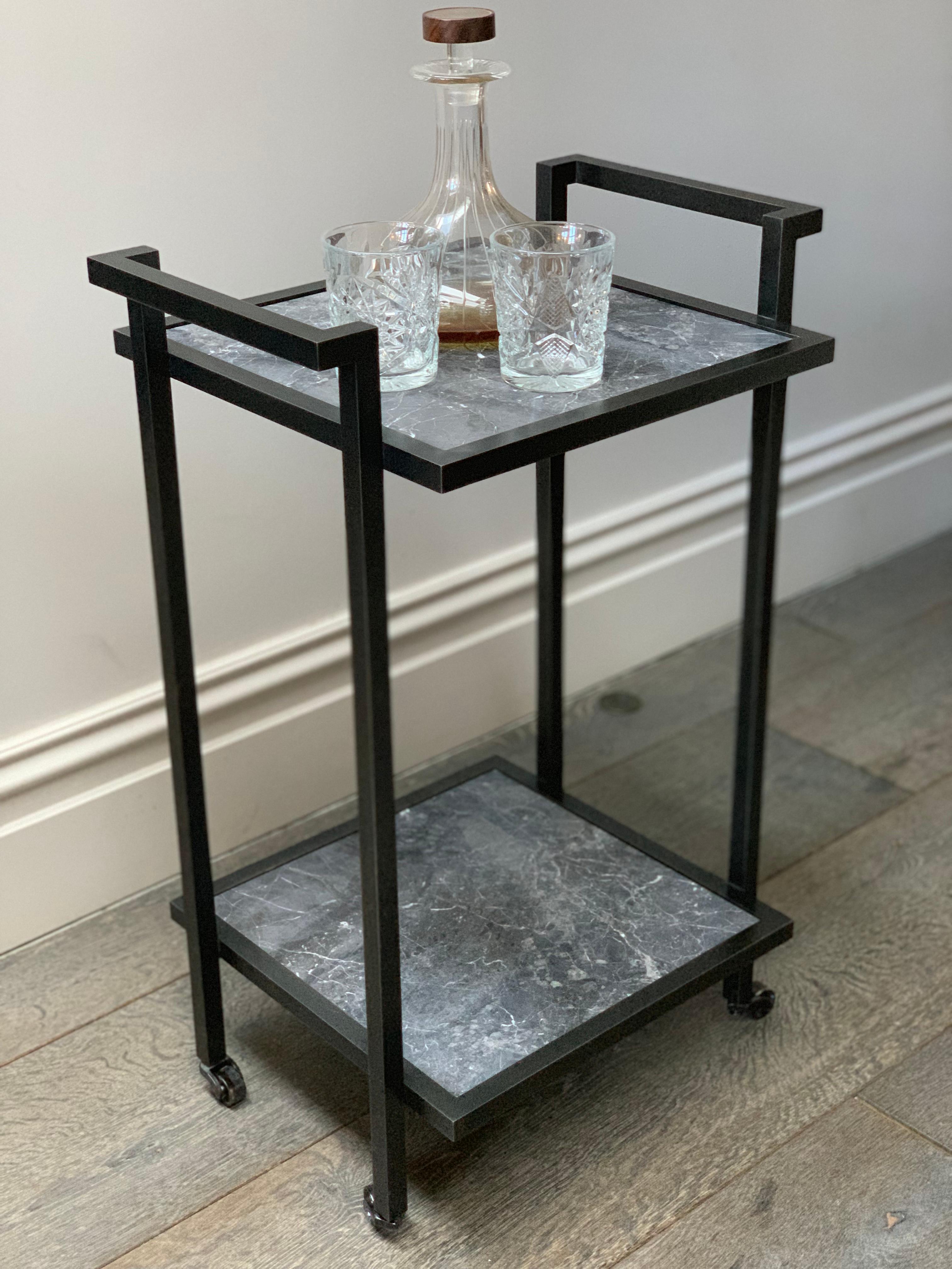 The Bacco Drinks Trolley is not just a functional piece of furniture, it is a statement of style. With its sleek, sculptured design and perfectly proportioned dimensions, this trolley exudes a glamorous and masculine aesthetic that is sure to