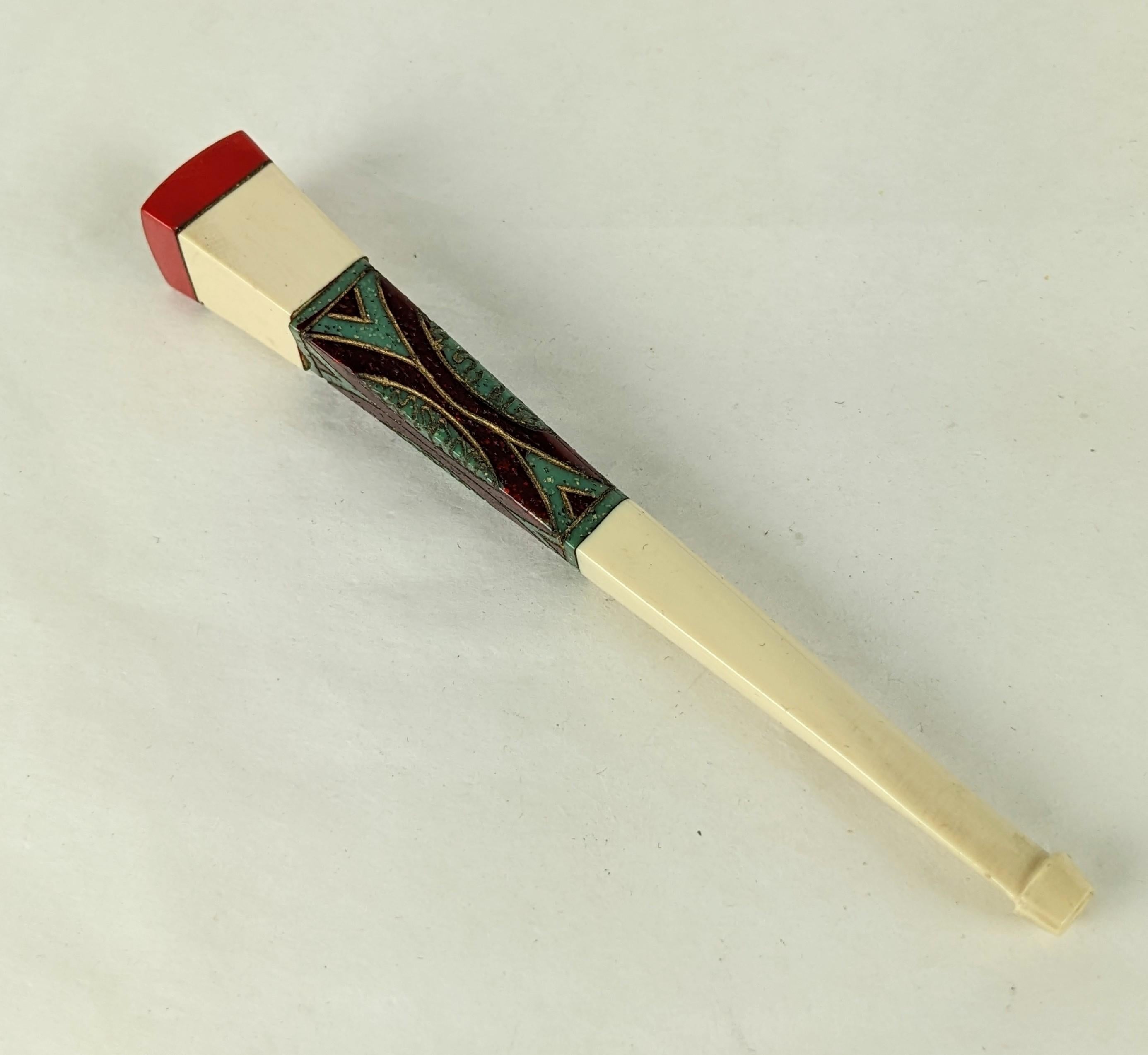 Art Deco Bakelite and Carved Bone Cigarette Holder with Case. Bone carved cigarette holder with bakelite station in the Egyptian Revival style in its own black silk faille case lined in ivory calf leather. The bakelite is laminated in deep ruby with