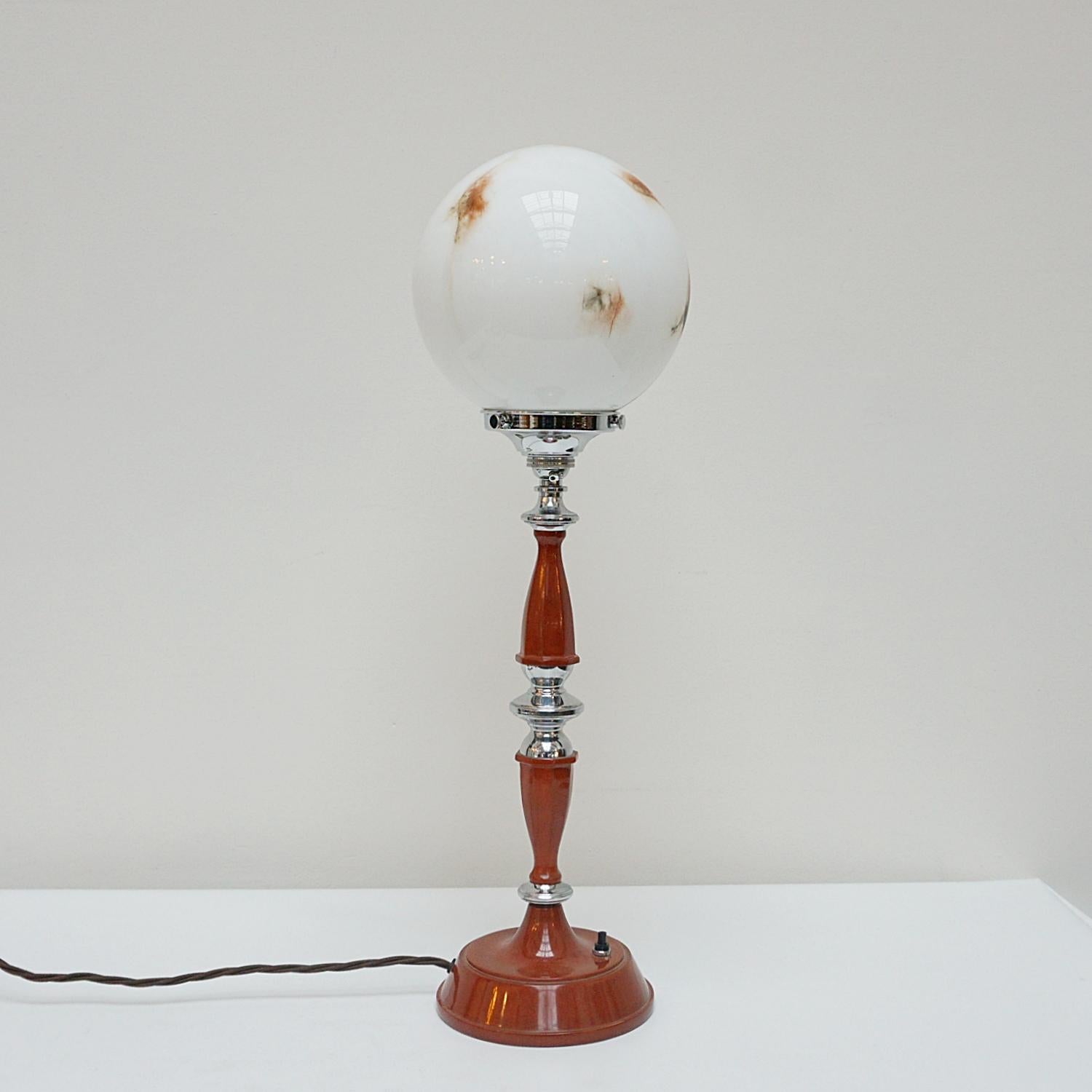 An original Art Deco lamp. Feathered glass globe shade with redded bakelite and chrome stem. 

Dimensions: H 56cm W 15cm

Origin: English

Item Number: J306

All of our lighting is fully refurbished, re-wired, and re-chromed with some replacement