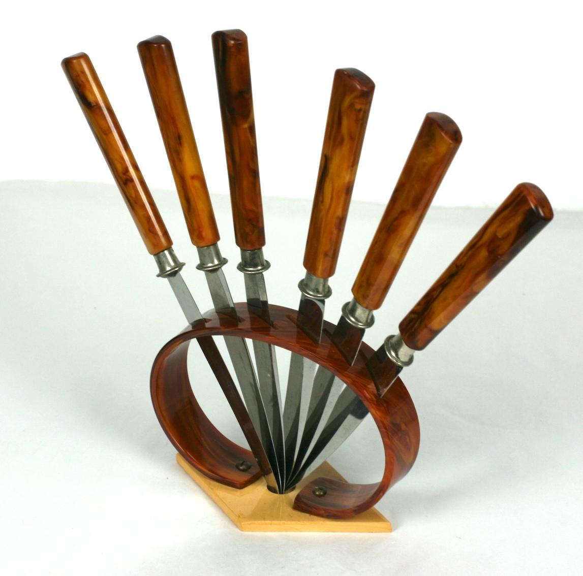 Art Deco Bakelite Fruit Knife Set from the 1930's. Made in Germany. Butterscotch bakelite handled knives are set into a bakelite stand designed to display beautifully. 
Excellent condition.  1930's. 