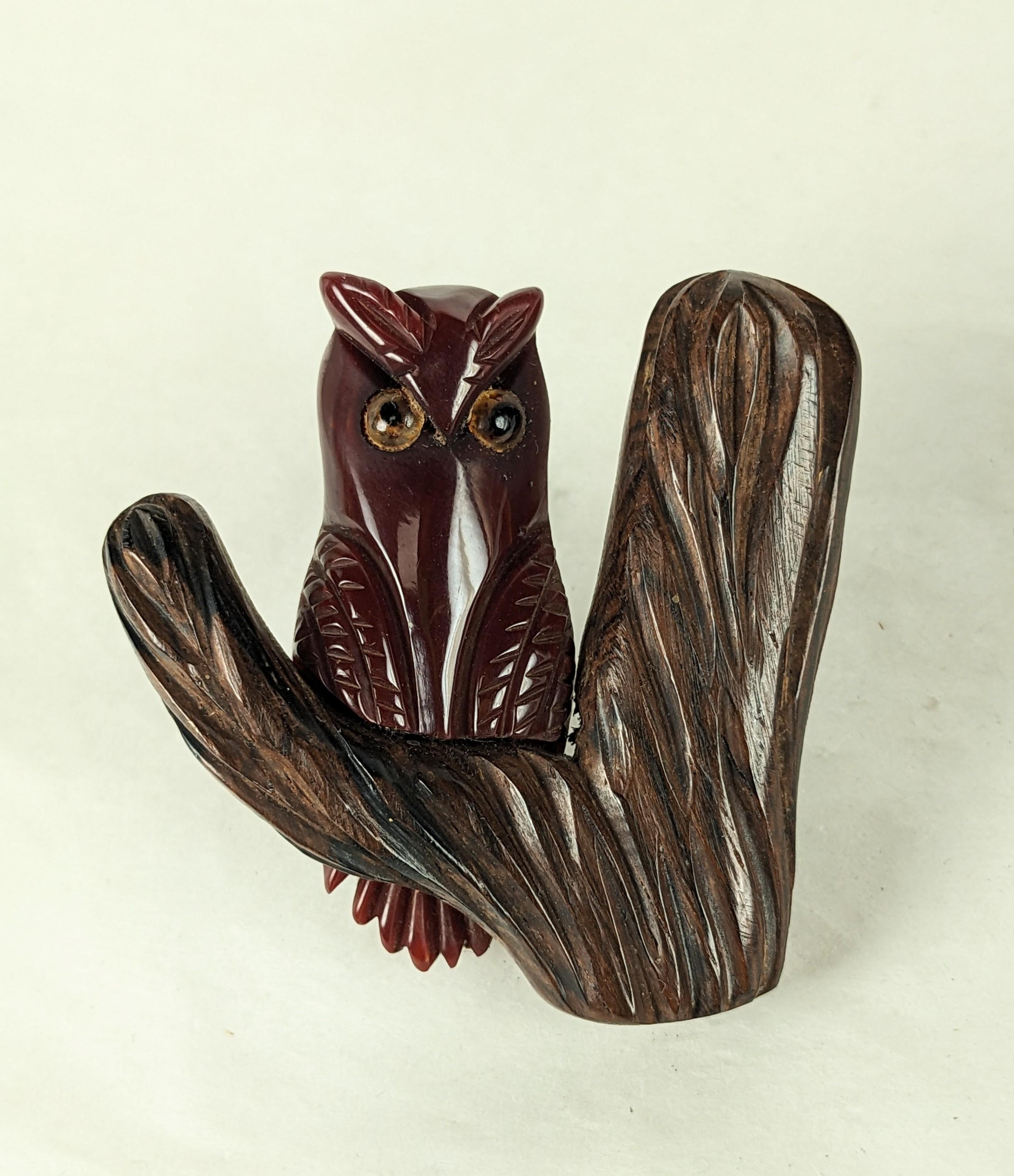 Charming Art Deco Bakelite Owl on Branch from the 1930's. Hand carved maroon bakelite owl with glass eyes is perched on a carved wood tree. American folk art jewelry. 2