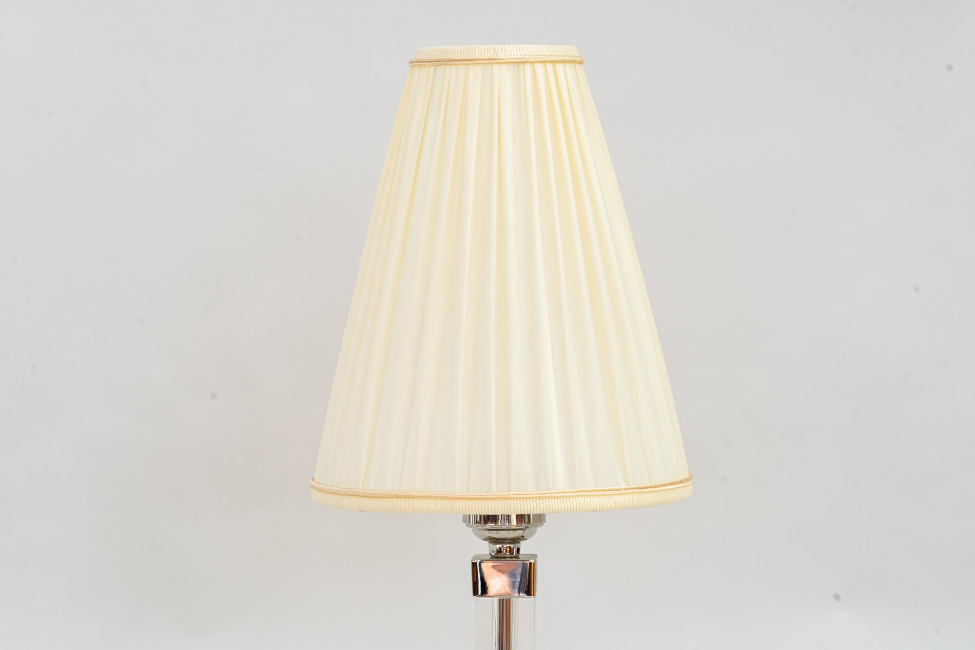 Art Deco Baklowits glass table lamp with fabric shade vienna around 1920s

Glas and brass ( nickel - plated )
The fabric shade is replaced ( New ).