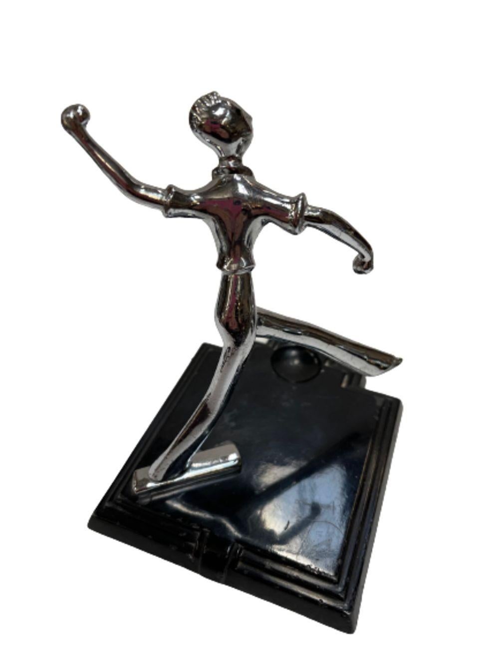 Decorative chrome Art Deco Round Ball lighter on a black enameled stepped base with a chromed figural sculpture of a ball player in mid-throw. This matching set was released by Ronson out of New Jersy in 1931.

Dimensions of lighter:
3