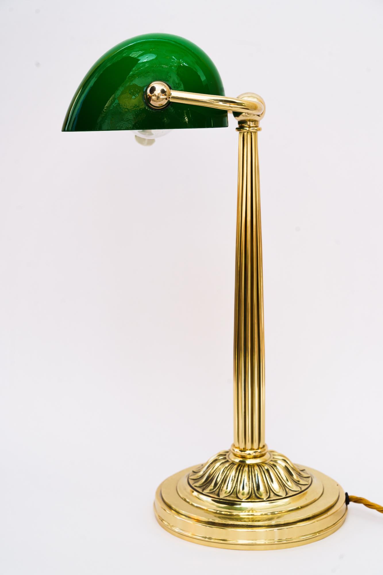 Art Deco banker table lamp with green glass shade vienna around 1920s
Brass polished and stove enameled
Original glass shade.