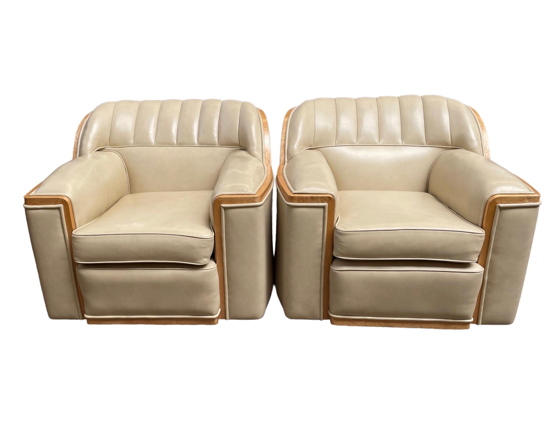 A fine Art Deco Harry and Lou Epstein Bankers Suite. Upholstered in cream leather, with maple banding and raised on chrome castors. 
Sofa. 
Height of back: 78cm
Height of seat: 46cm
Width: 186cm
Depth: 85cm
Each armchair.
Height of back: