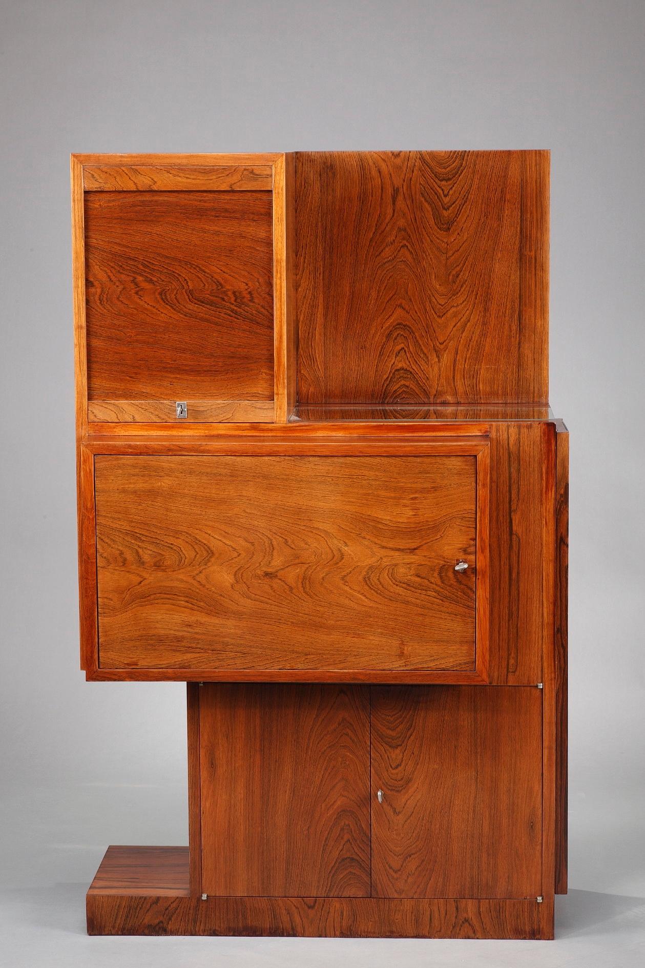 Asymmetrical Art Deco bar and drop-front desk crafted of rosewood veneer in the taste of André Sornay (French, 1902-2000). Both have rectangular containers and display geometric lines in the purest Art Deco style. The bar has two flap doors in the
