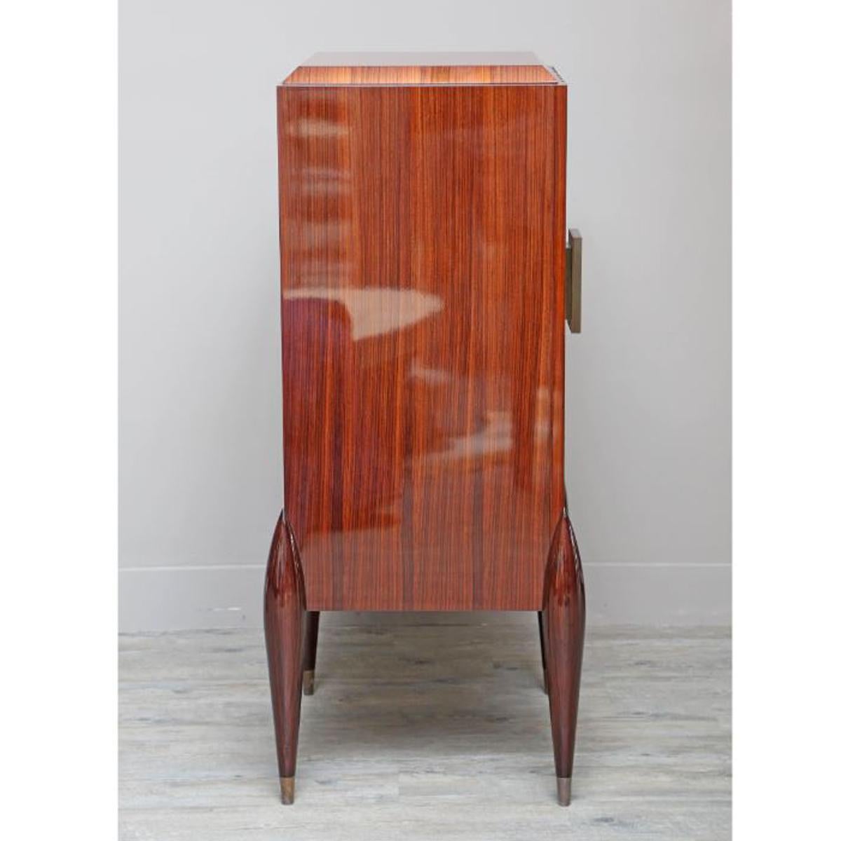 This beautiful Bar Cabinet is made of Rosewood and handmade in Japan. only 5 made. This masterpiece blends in any decor giving a field of heirloom elegance...