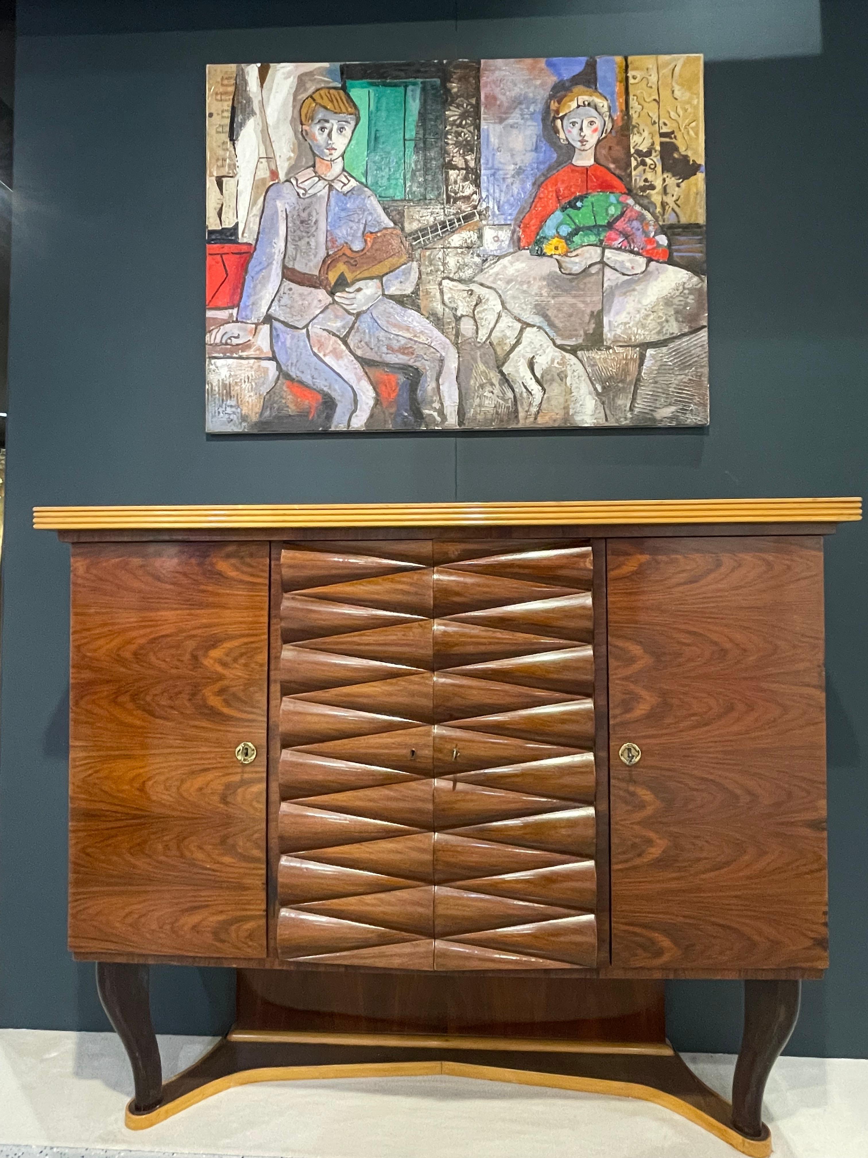 Large Italian mahogany Art Deco bar cabinet designed by Michele Merighi and made by Ronconi Cantù.
This cabinet is part of the dining room published on Fontana Arte (the Arting Company) page 248.
Excellent quality in perfect vintage condition.