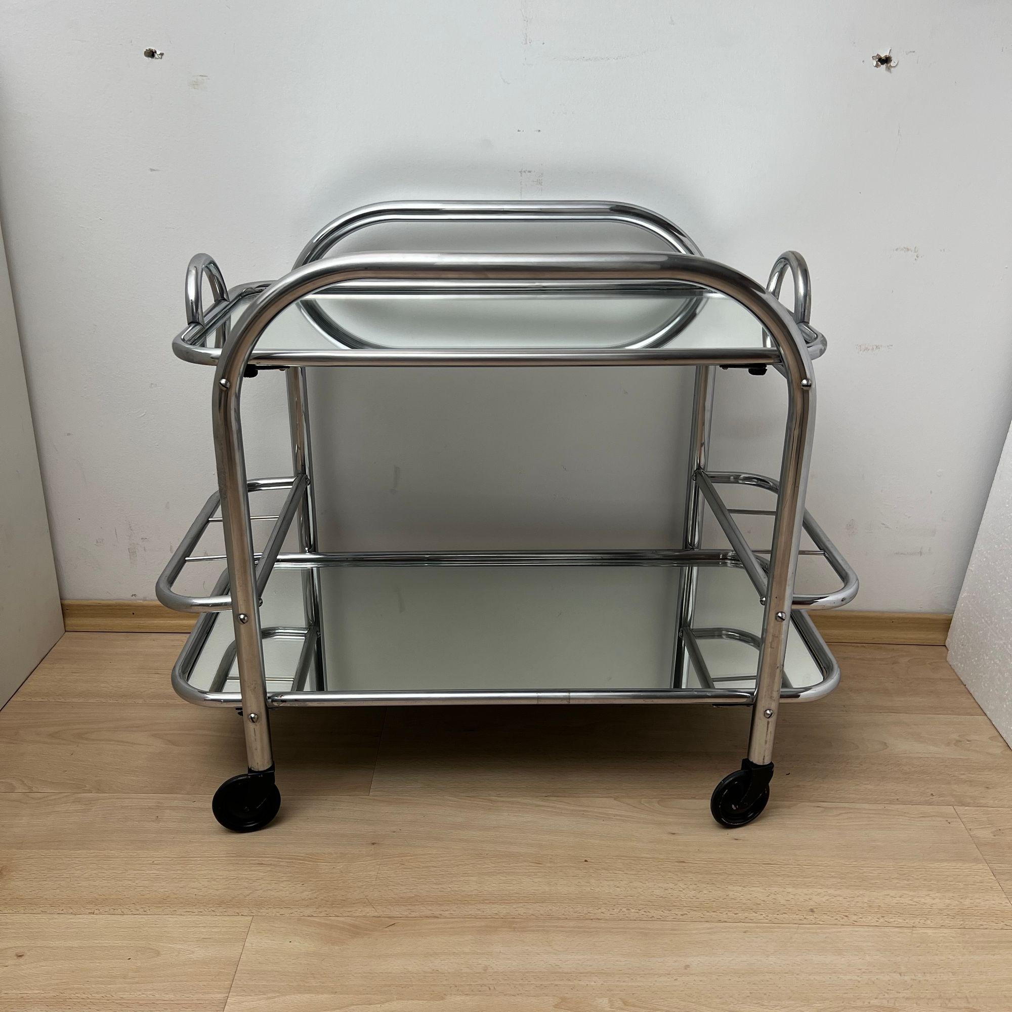 Art Deco Bar Cart or Serving Trolley, Chromed Steeltubes, France circa 1925

Design: Robert Mallet-Stevens (Paris, 1886 - 1945)
Chromed thick steel tube. Original old mirrored glass. Upper tray can be removed for serving.
Mobile on 4 casters. 6