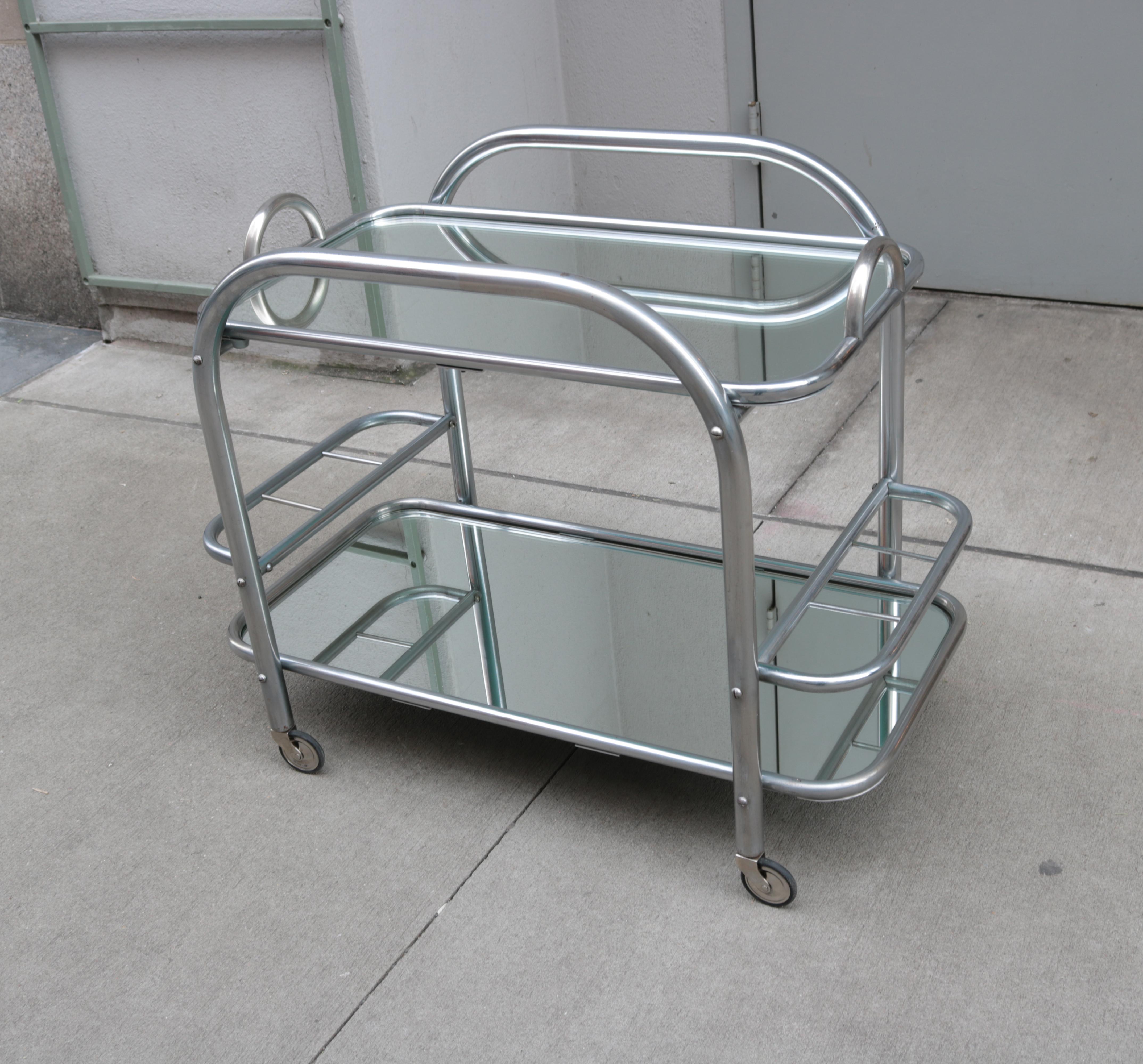 Art Deco Bar Cart With Removable Tray.
Nickeled metal with mirrored surfaces.