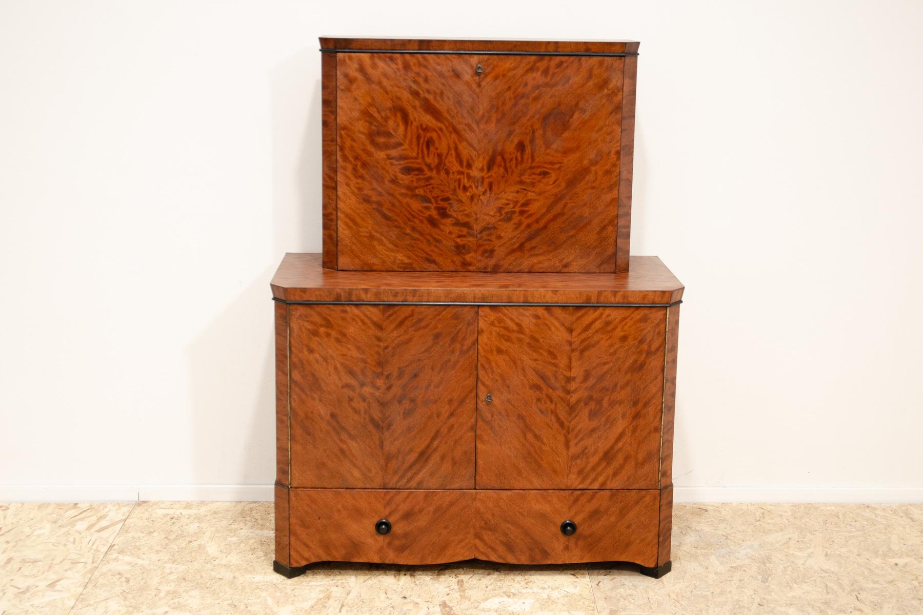 This ART DECO style piece was made in the former Czechoslovakia in the 1930´s.

It is made of solid wood with walnut veneer.  You can use the cabinet as a bar or as a sideboard.

The furniture is in excellent condition, it has been completely