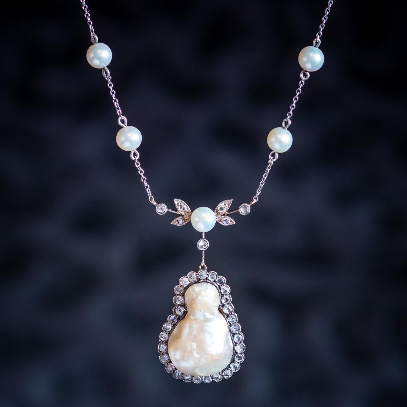 A fabulous Lavaliere necklace from the early 20th Century featuring a wonderful pear-shaped pendant set with an irregular shaped Baroque Pearl haloed with twinkling Rose cut Diamonds.

Further Pearls and Diamonds are decorated throughout the chain