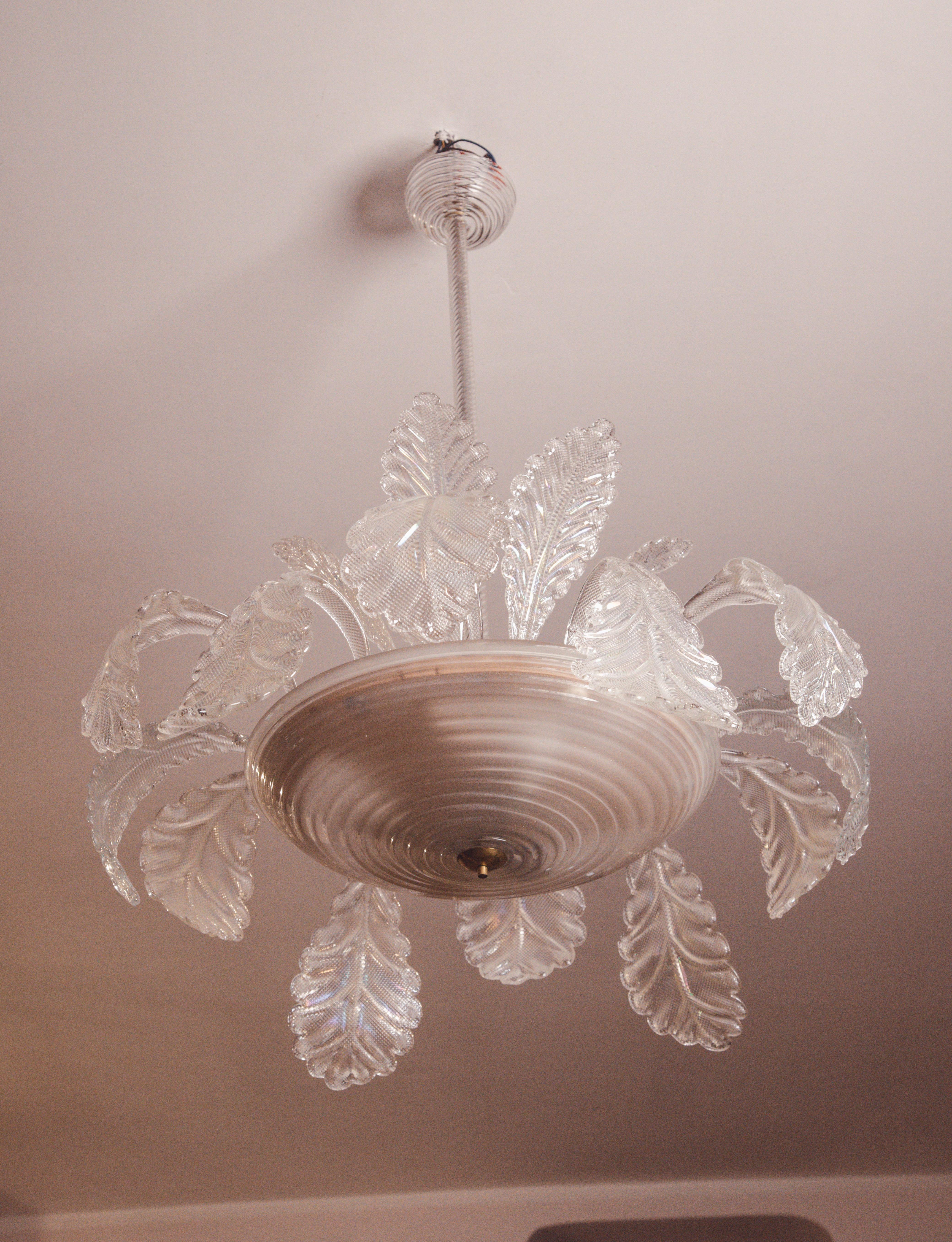 Extraordinary Art Deco chandelier made by the glassworks Barovier & Toso in the 1940s-1950s.
The chandelier is 110 centimetres high and 85 centimetres wide.
It mounts three E27 lights. The chandelier is very rich: the glass elements, all original