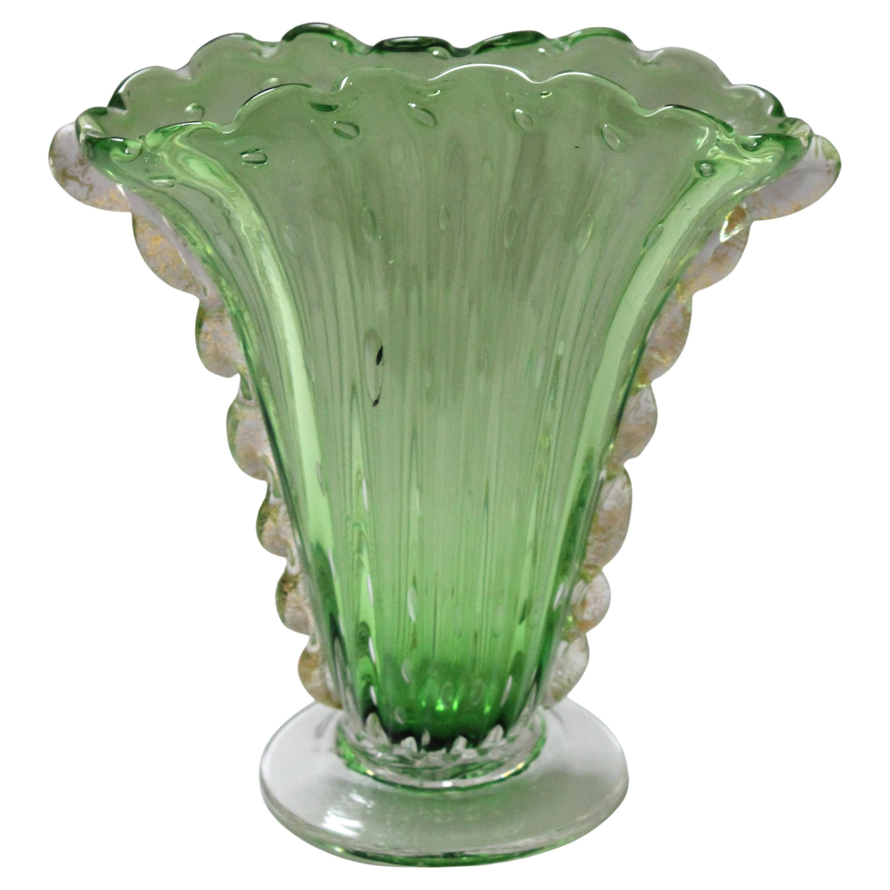 Art Deco 1930s Barovier et Toso Murano glass vase light green with controlled elongated bubbles and gold inclusions. 

The controlled bubbles near the top are close to circular, but are elongated as the glass goes near the base. The pontil shows