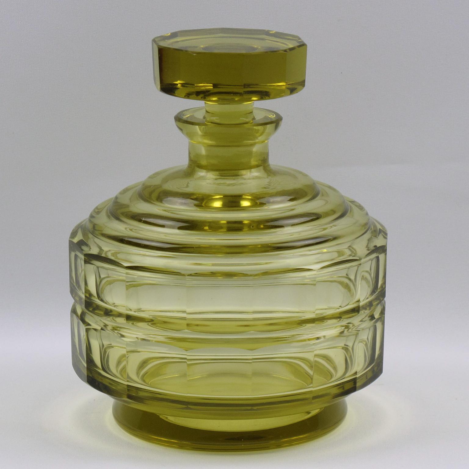Lovely Art Deco crystal liquor or alcohol decanter set with seven matching cordial or aperitif glass. Very nice transparent yellow corn color. The stopper, body, and glass are all cut and faceted to a fine standard. Heavy quality crystal with a
