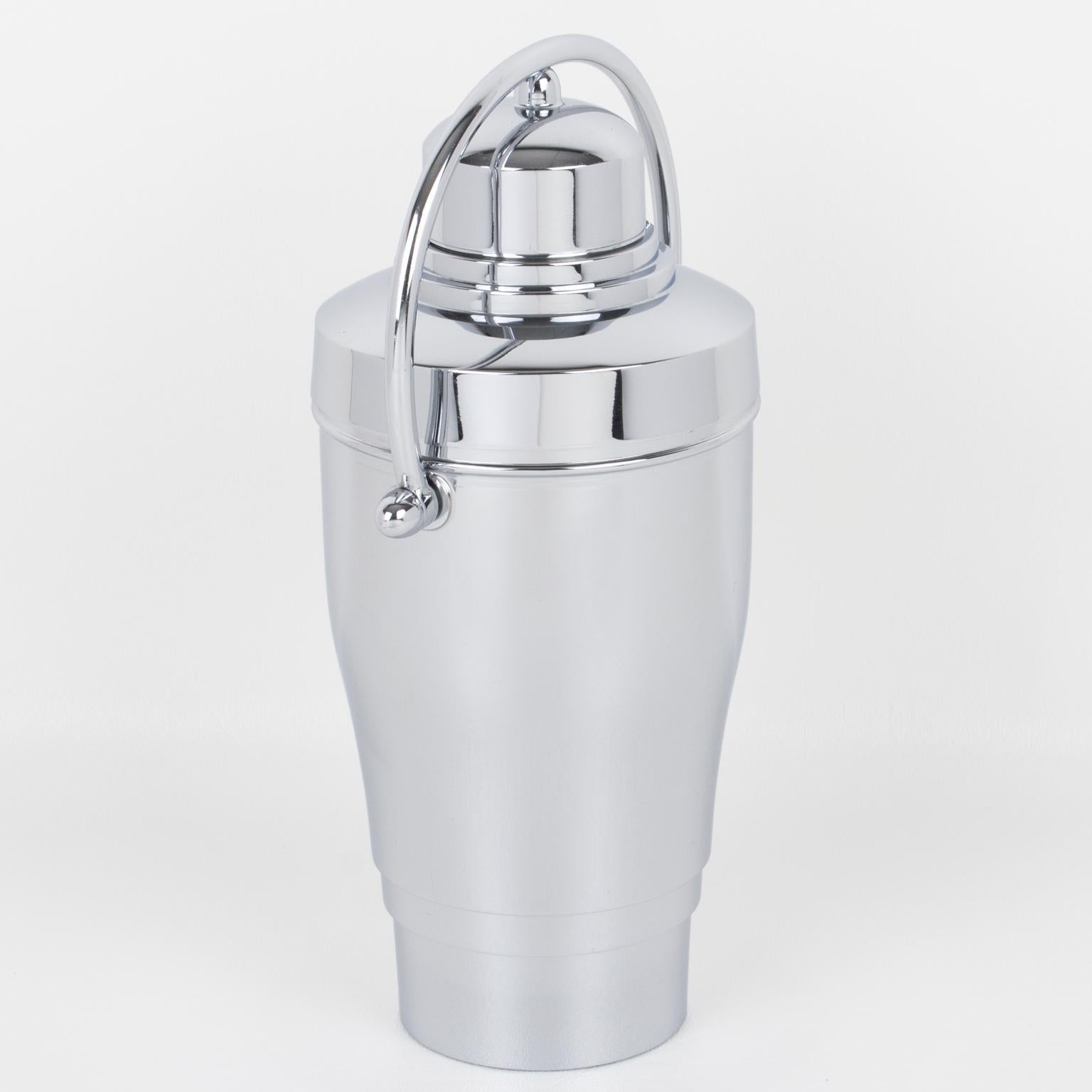 This stunning English Art Deco chrome cocktail or Martini shaker features a streamlined design, boasting a puffy shape and a rotating locking handle. 
This is a typical yacht bar cocktail shaker, allowing the bartender to shake the drink with one