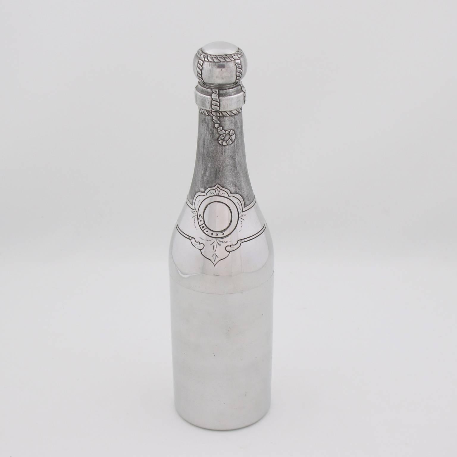 Rare French Art Deco polished aluminum cocktail or Martini shaker. Gorgeous champagne bottle design with refined detailed engraving. Three sectioned designed cocktail shaker with removable cap and strainer. Marked underside: '184' and 'déposé'