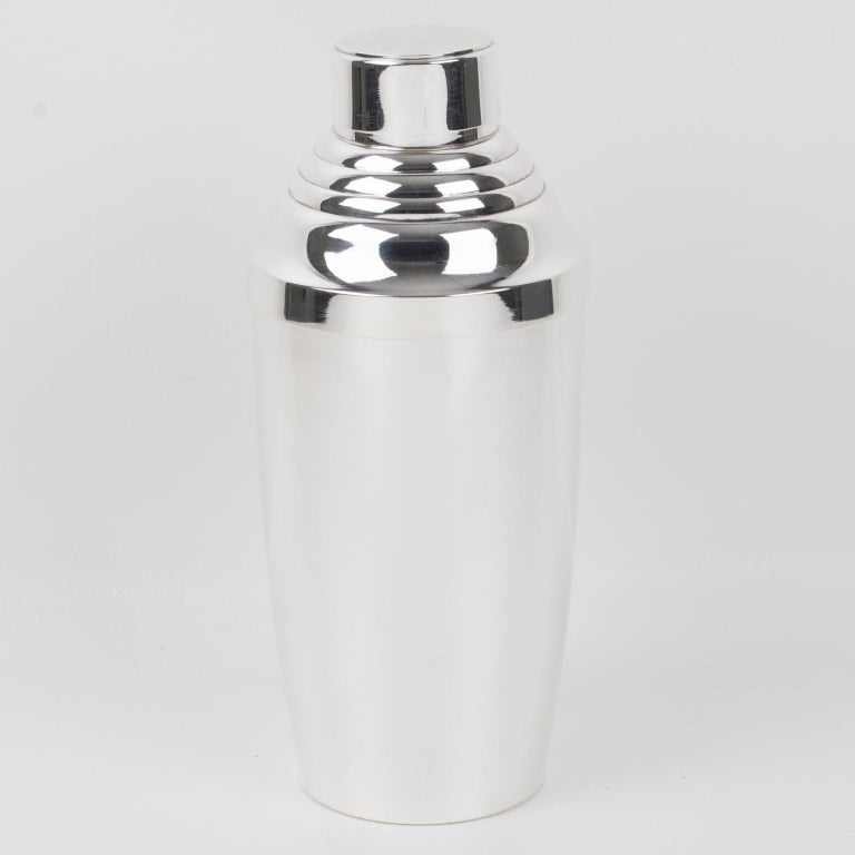 Shaker et six verres à cocktail en métal argenté Art Déco, France