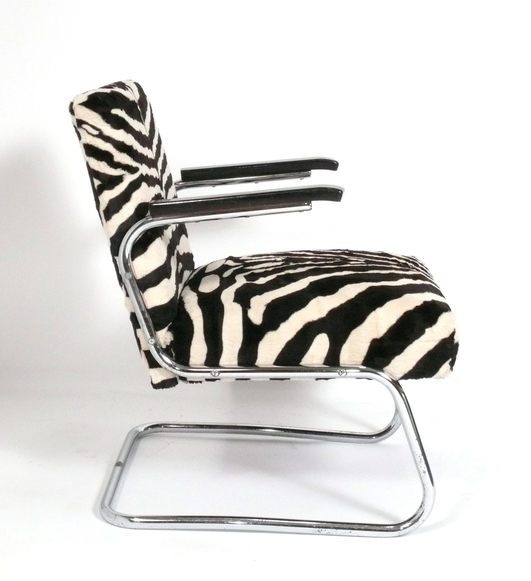 Art Deco Bauhaus Era Chrome Lounge chair, German, circa 1930s. It has recently been reupholstered in a velvety zebra print fabric. It is signed with a metal label on the bottom stretcher, which reads 